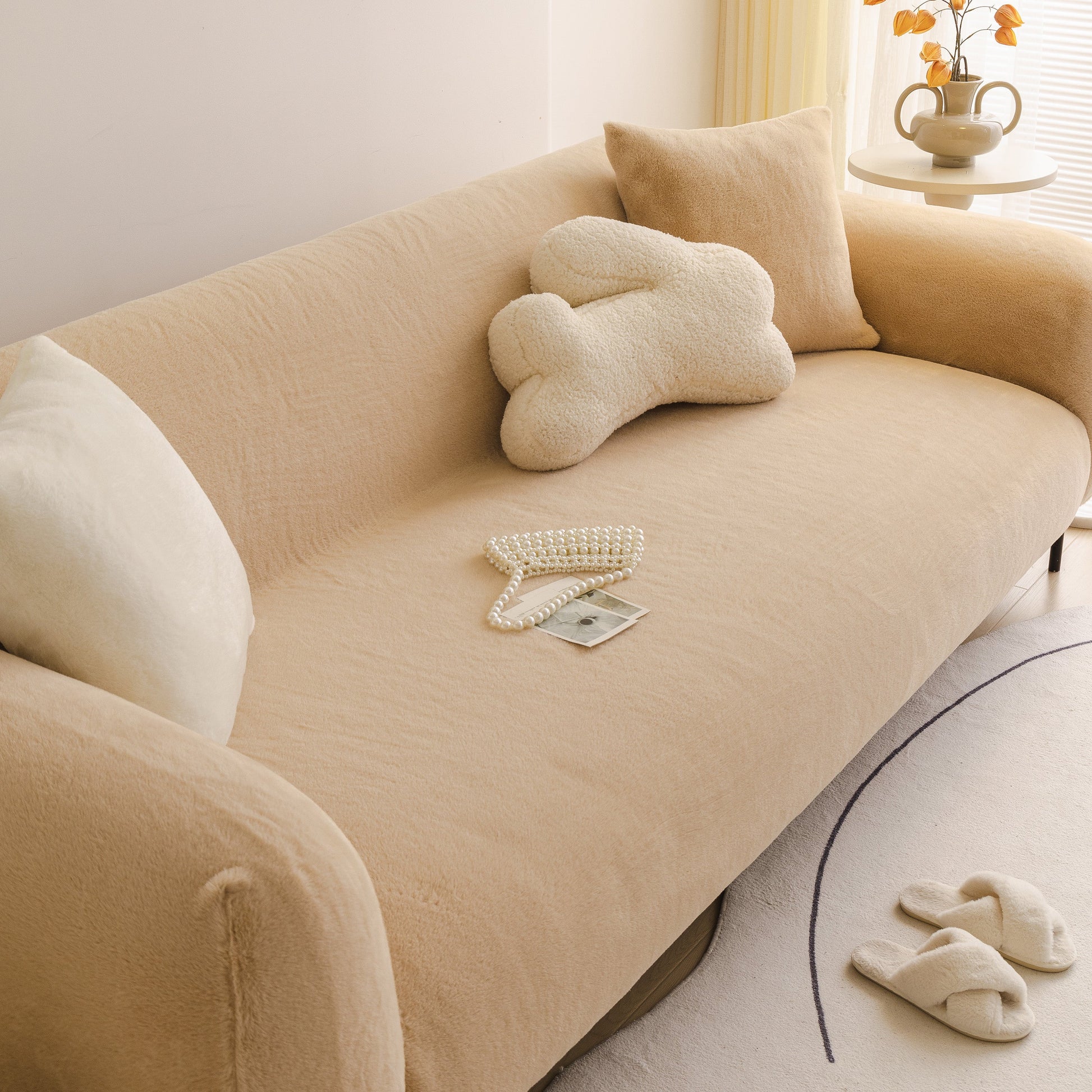 Soft Plush Warm Sofa Cover Stretchable Cozy Velvet Couch Protector for Fall & Winter draped over a beige sofa with pillows and decor.