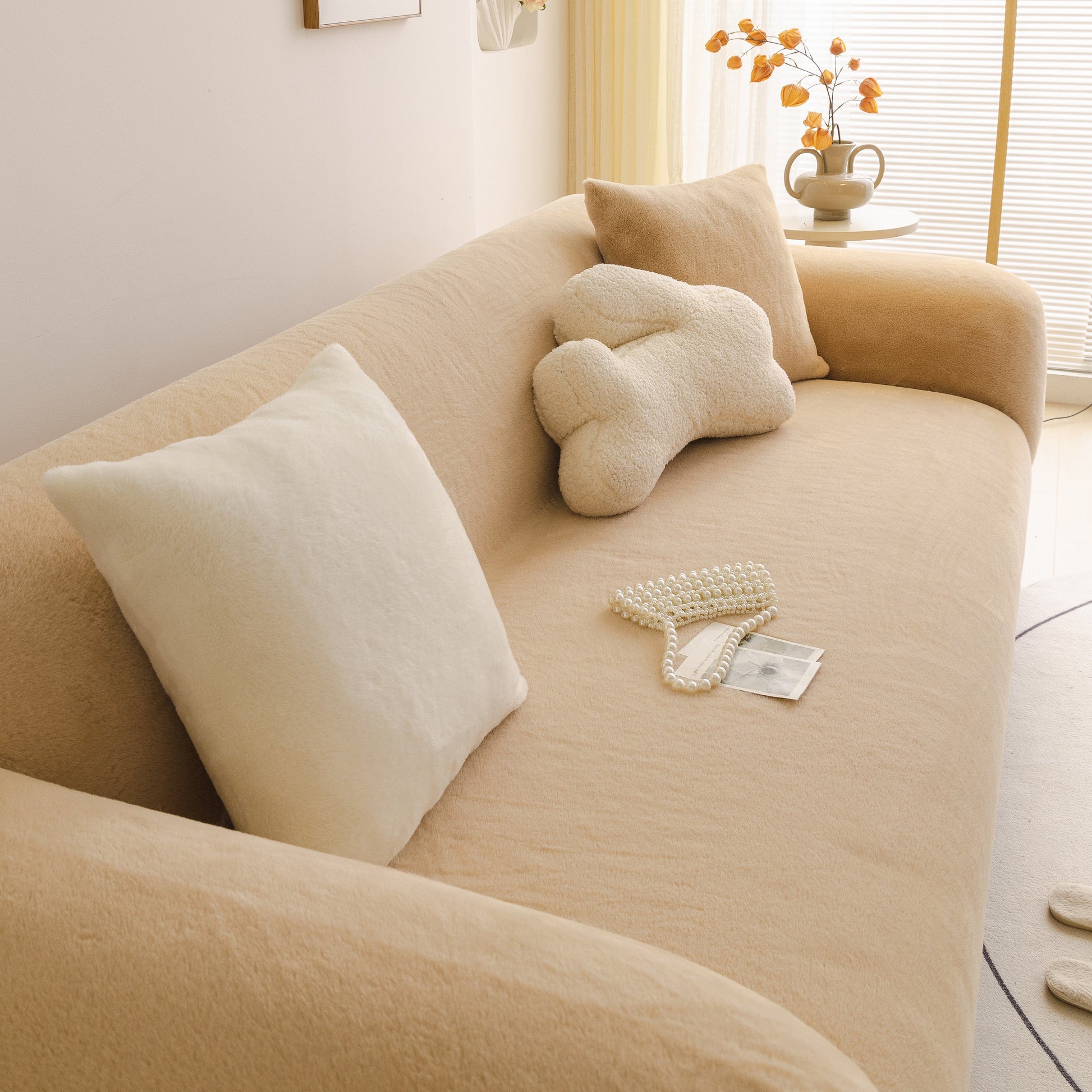 Soft Plush Warm Sofa Cover Stretchable Cozy Velvet Couch Protector for Fall & Winter on a beige sofa with pillows.