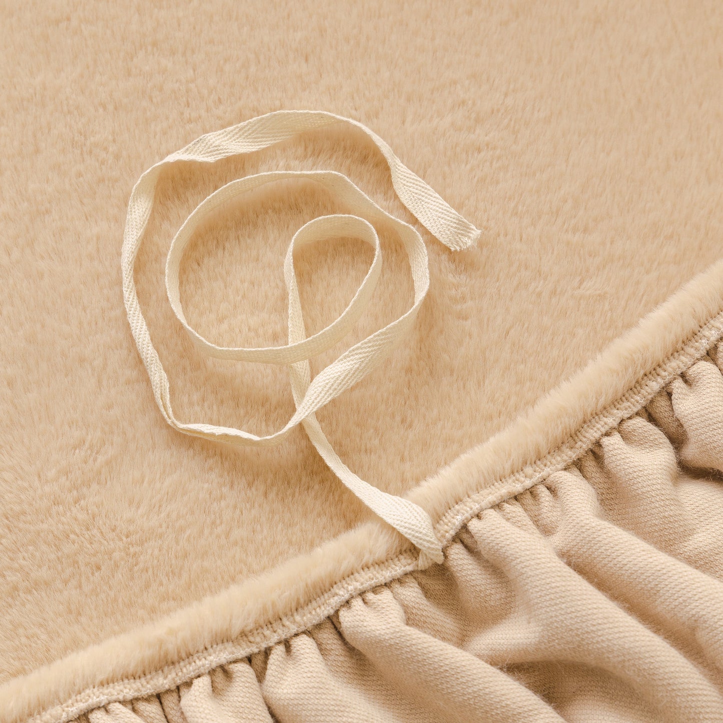 Close-up of Soft Plush Warm Sofa Cover Stretchable Cozy Velvet Couch Protector for Fall & Winter with elastic edge detail.