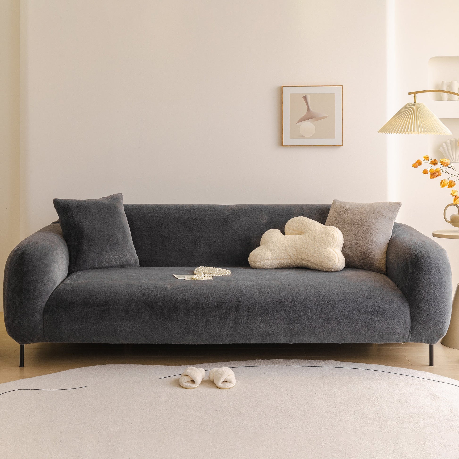 Soft Plush Warm Sofa Cover Stretchable Cozy Velvet Couch Protector for Fall & Winter on a dark gray sofa.