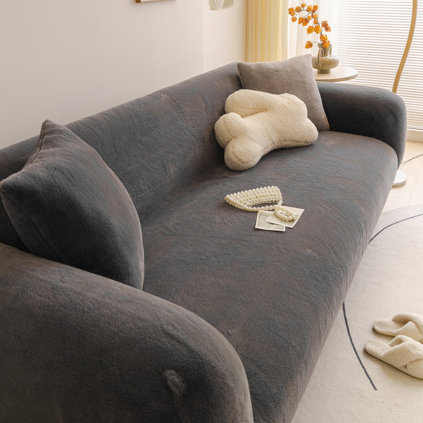 Soft Plush Warm Sofa Cover Stretchable Cozy Velvet Couch Protector for Fall & Winter on a modern sofa with decorative pillow.