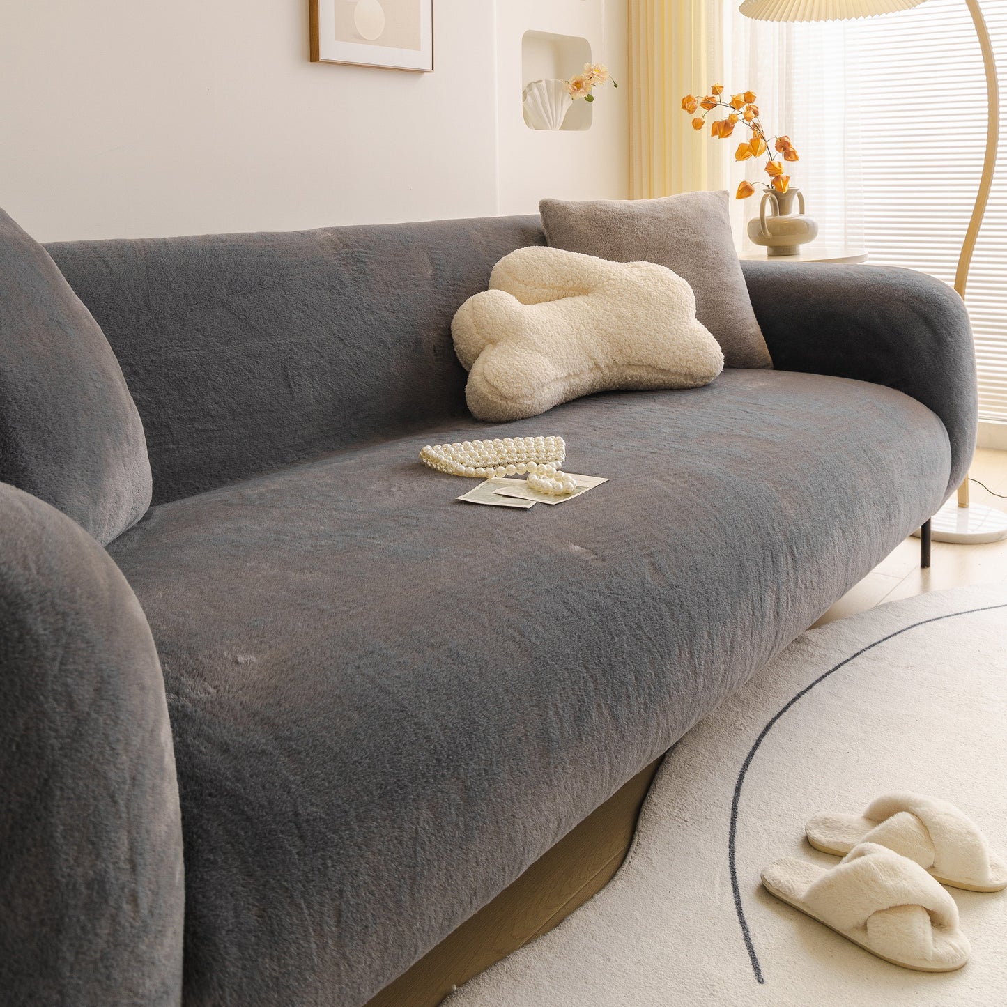 Soft Plush Warm Sofa Cover Stretchable Cozy Velvet Couch Protector for Fall & Winter on a modern gray sofa