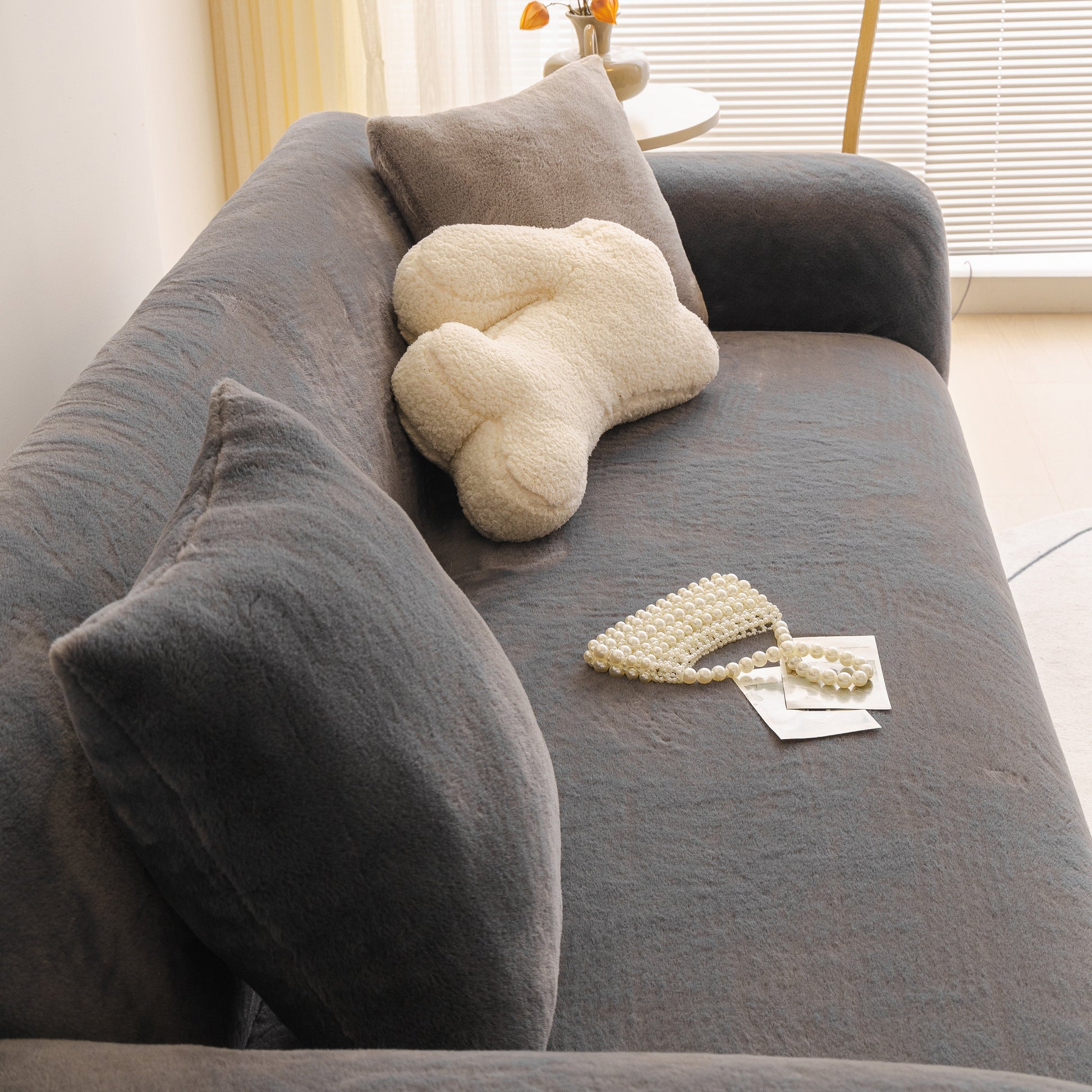 Soft Plush Warm Sofa Cover Stretchable Cozy Velvet Couch Protector for Fall & Winter on a modern living room sofa.