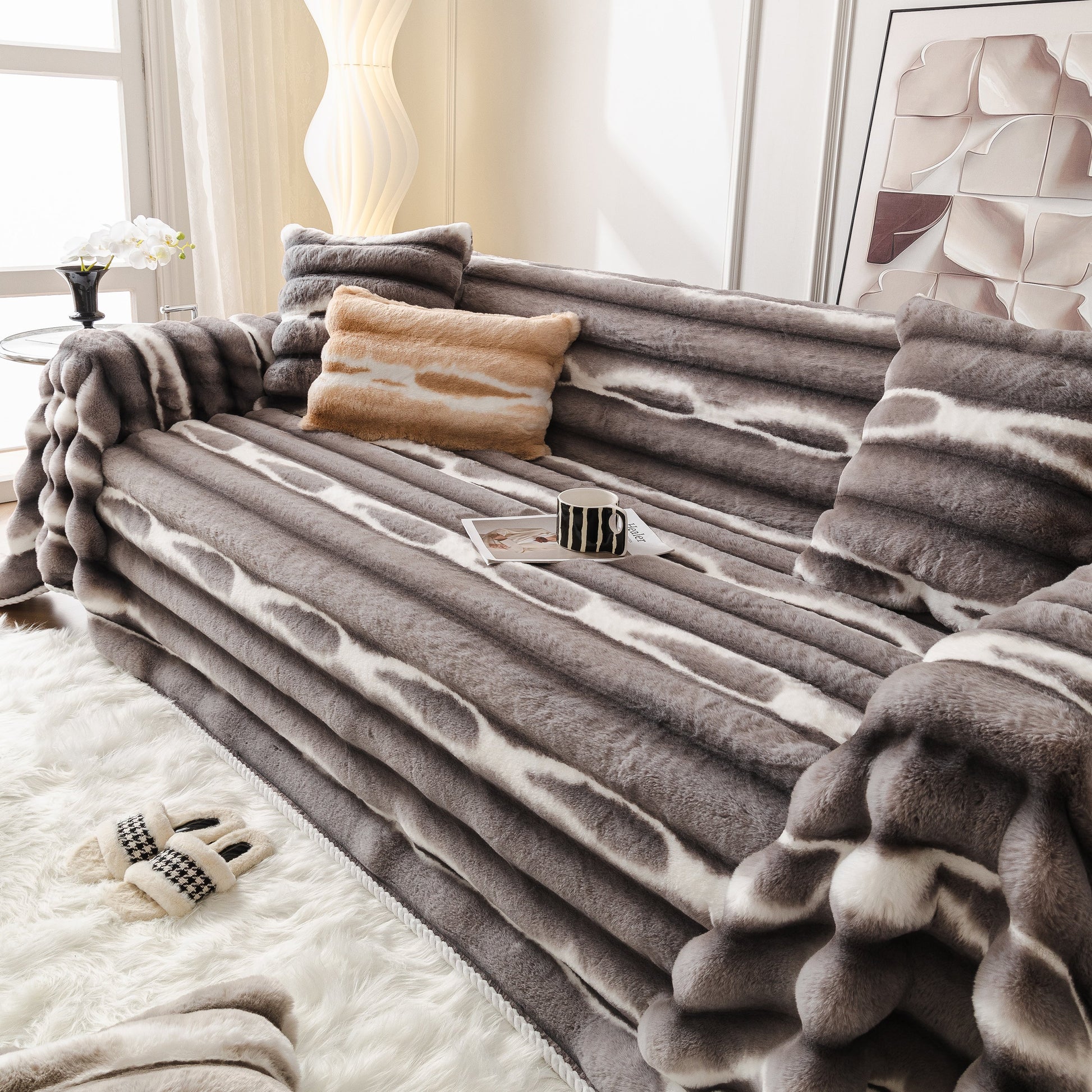 Elegant living room featuring an Ultra Soft Faux Fur Couch Cover – Large, Fluffy, and Elegant Sofa Throw Blanket on a modern sofa.