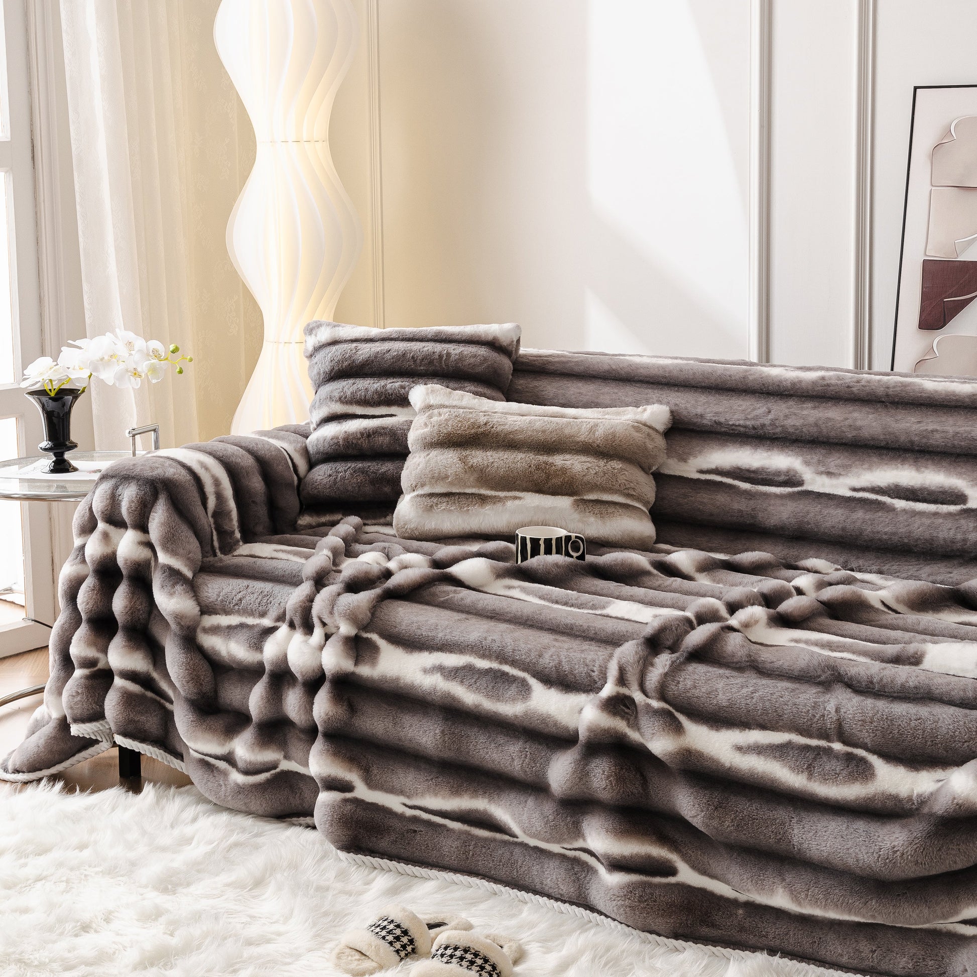 Ultra Soft Faux Fur Couch Cover – Large, Fluffy, and Elegant Sofa Throw Blanket on a modern sofa with pillows in a stylish living room.