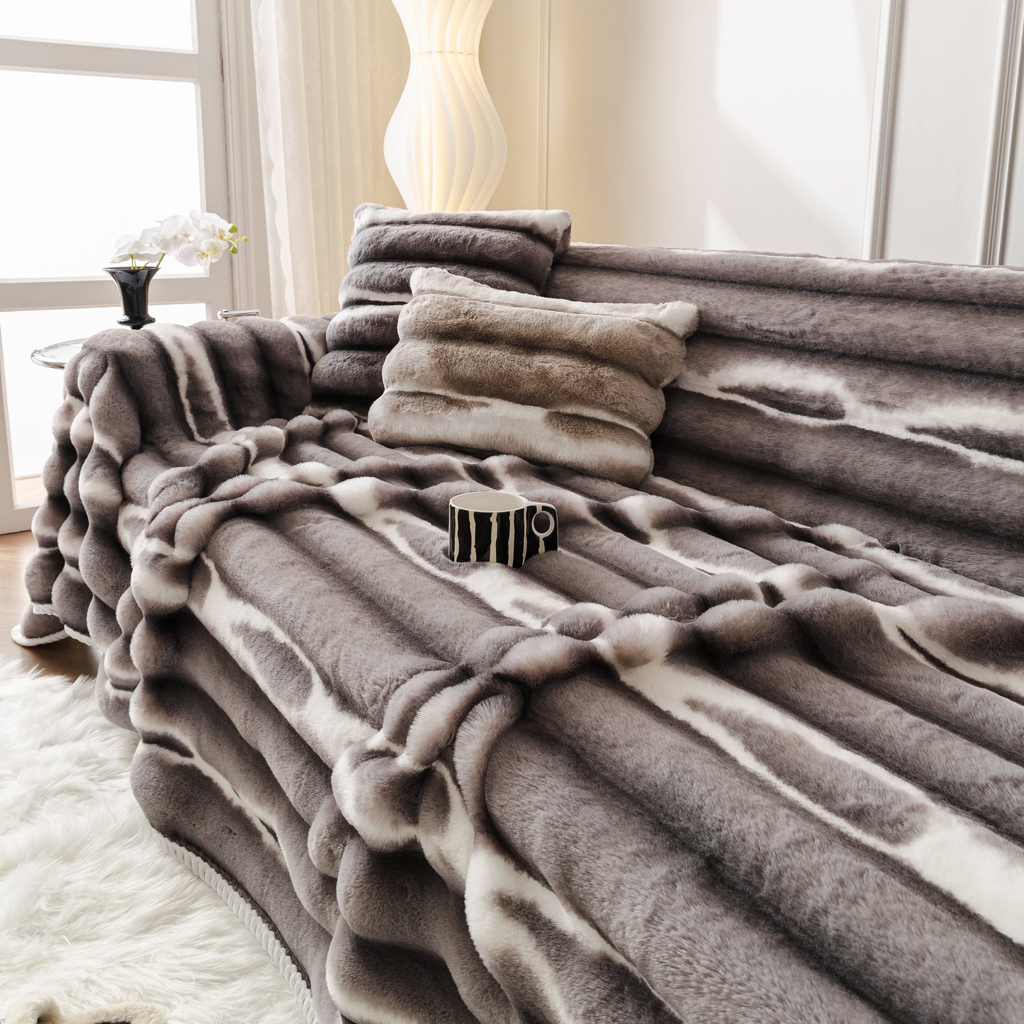 Luxurious living room with Ultra Soft Faux Fur Couch Cover – Large, Fluffy, and Elegant Sofa Throw Blanket draped on a modern sofa.