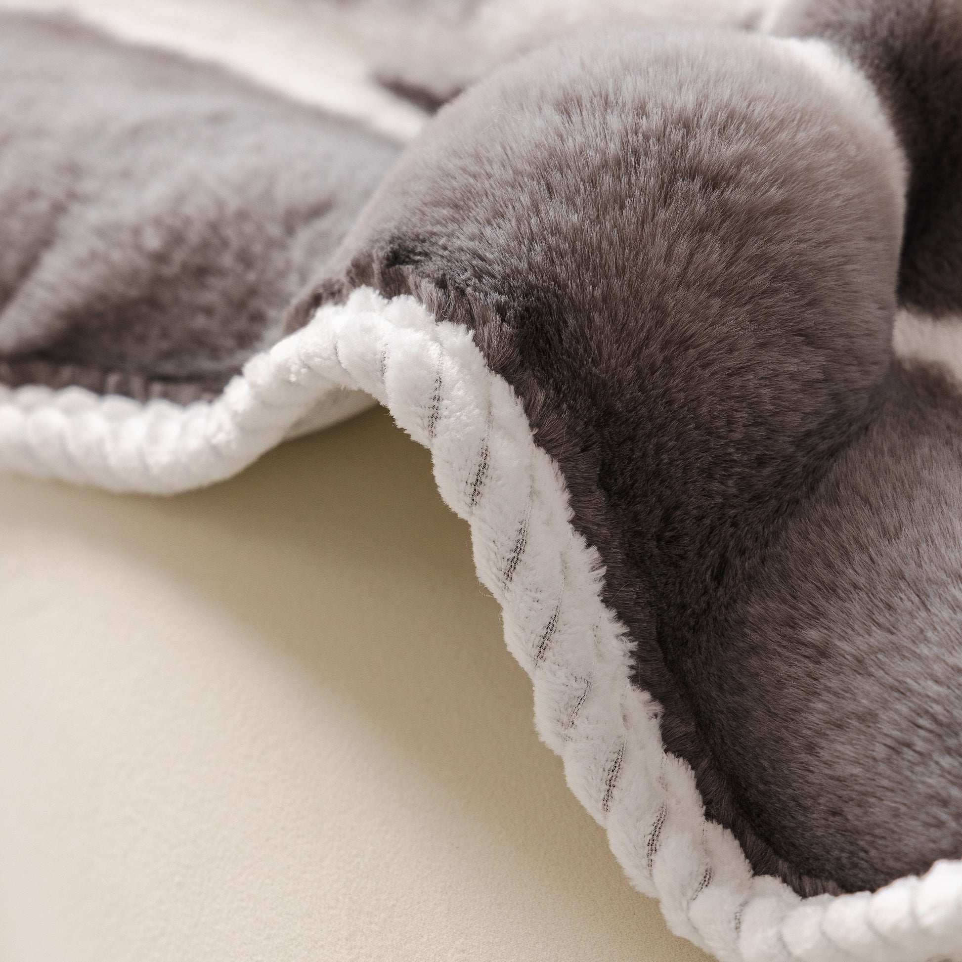 Close-up of Ultra Soft Faux Fur Couch Cover – Large, Fluffy, and Elegant Sofa Throw Blanket showcasing plush texture and durable seams.