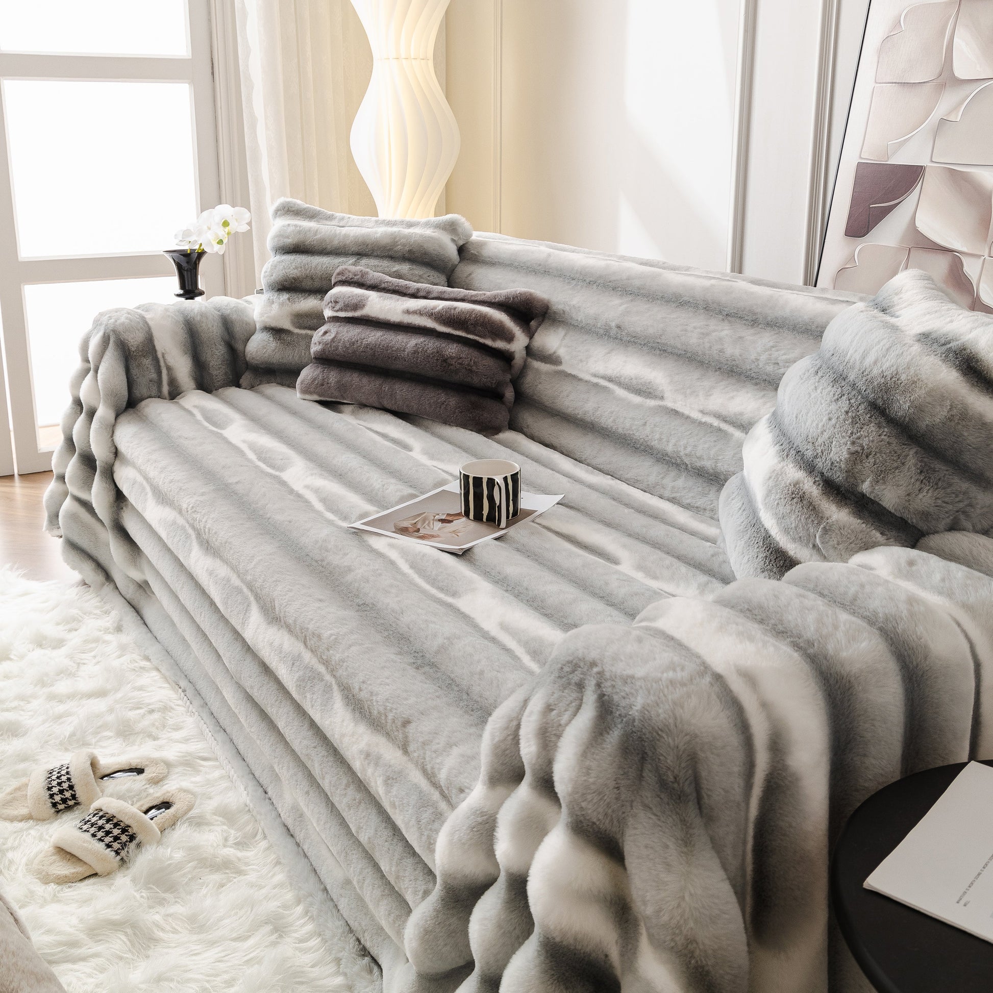 Luxurious living room with Ultra Soft Faux Fur Couch Cover – Large, Fluffy, and Elegant Sofa Throw Blanket in grey gradient on a cozy sofa.