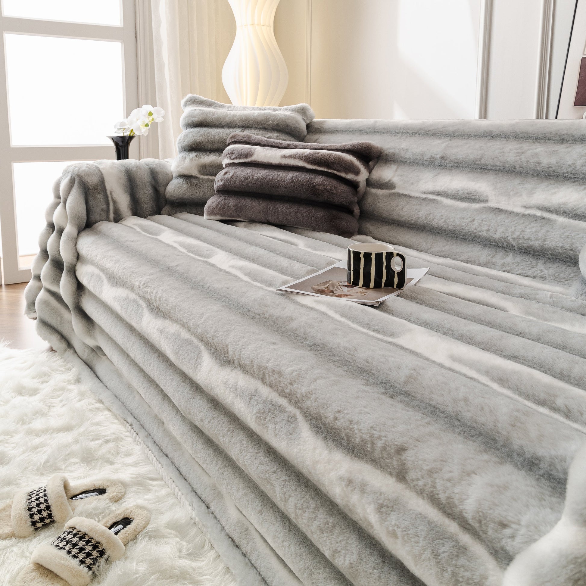 Ultra Soft Faux Fur Couch Cover – Large, Fluffy, and Elegant Sofa Throw Blanket on grey sofa with plush texture.