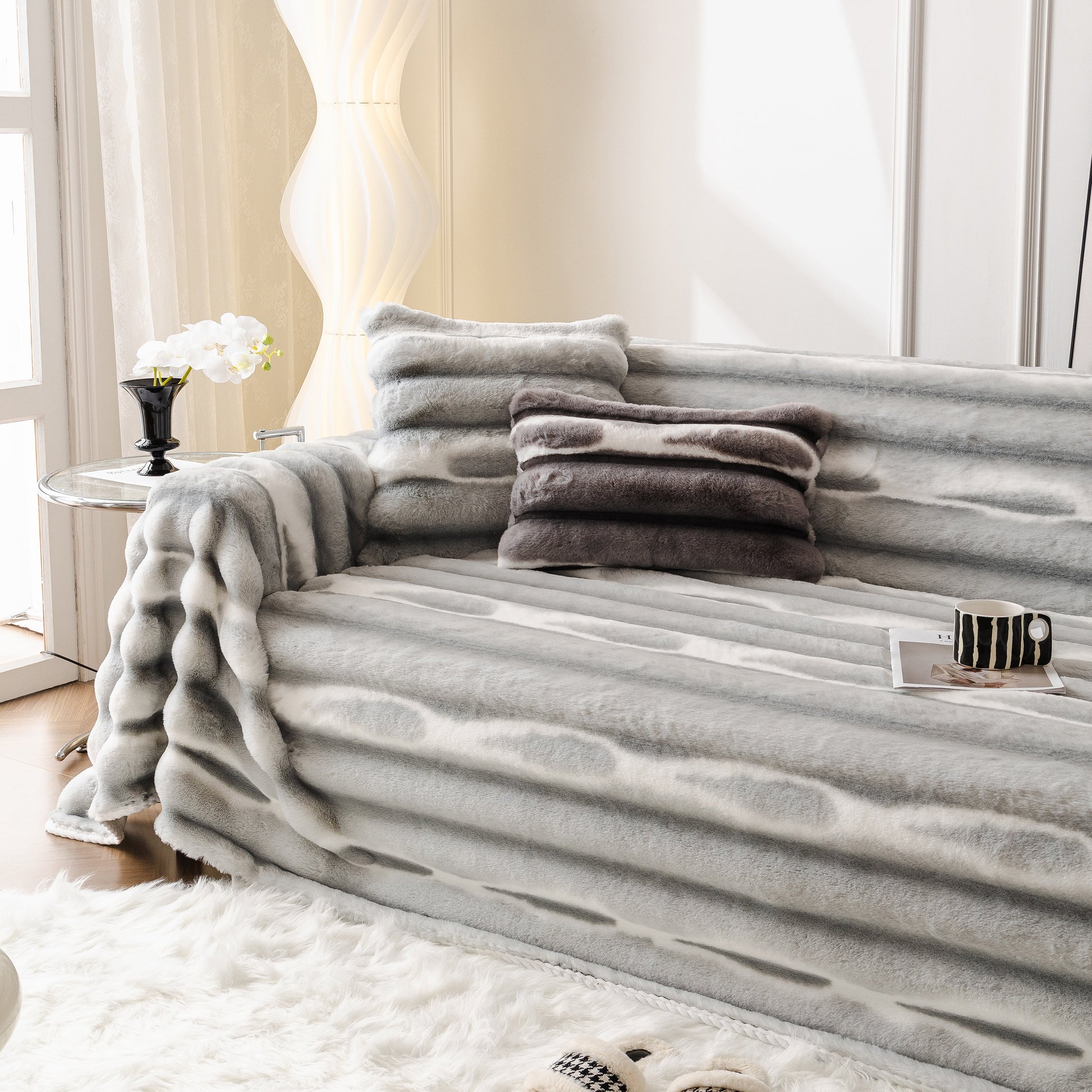 Living room with Ultra Soft Faux Fur Couch Cover – Large, Fluffy, and Elegant Sofa Throw Blanket enhancing a stylish grey sofa.
