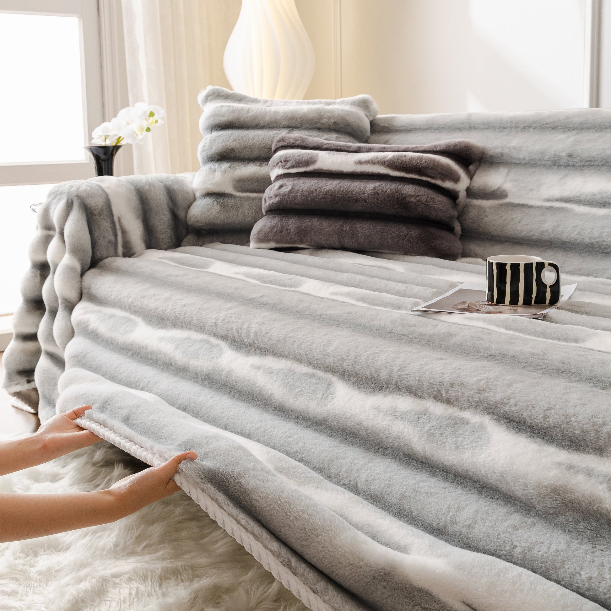 Ultra Soft Faux Fur Couch Cover – Large, Fluffy, and Elegant Sofa Throw Blanket on a sofa with gradient design, enhancing comfort and style.
