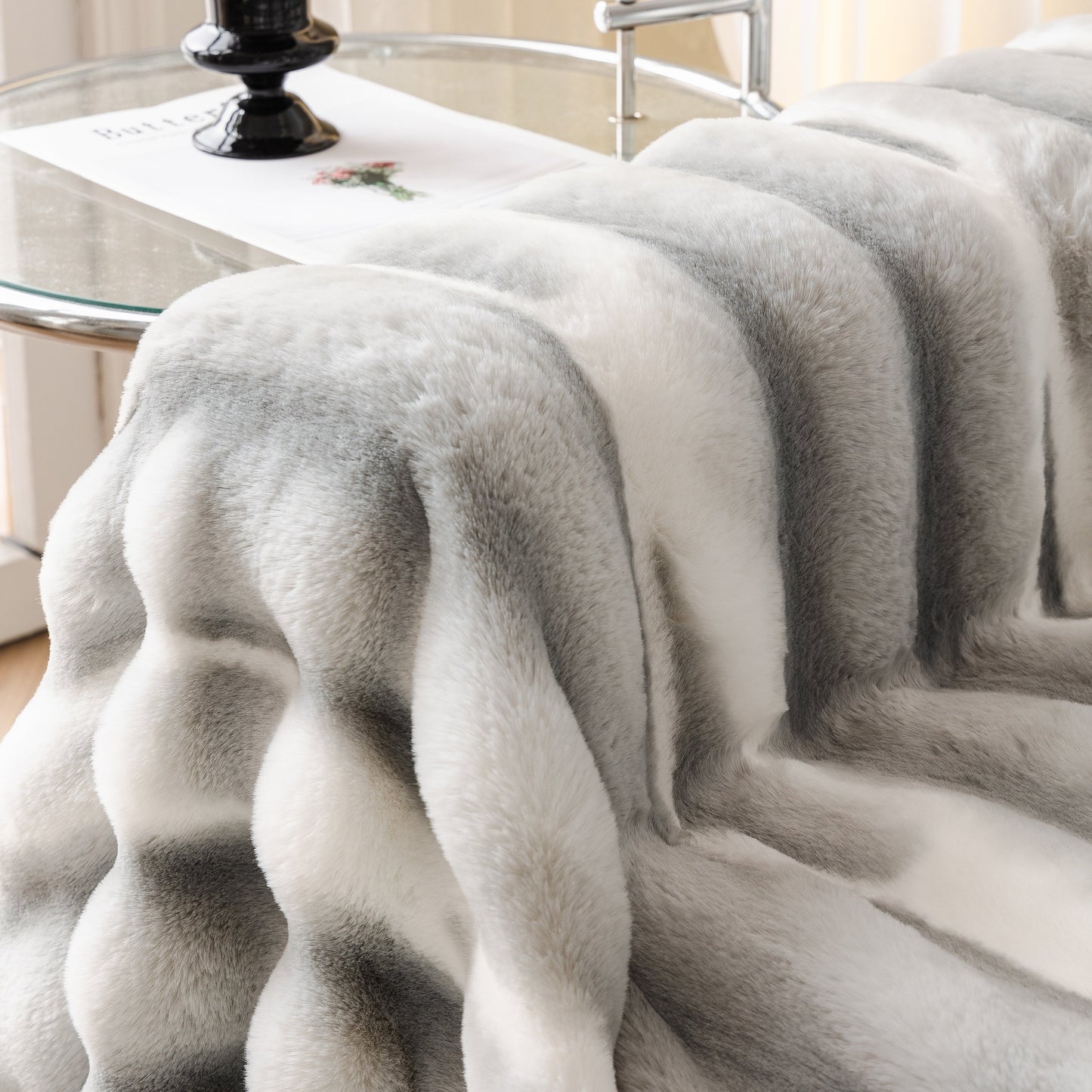 Ultra Soft Faux Fur Couch Cover – Large, Fluffy, and Elegant Sofa Throw Blanket displayed on a couch with a gradient pattern.