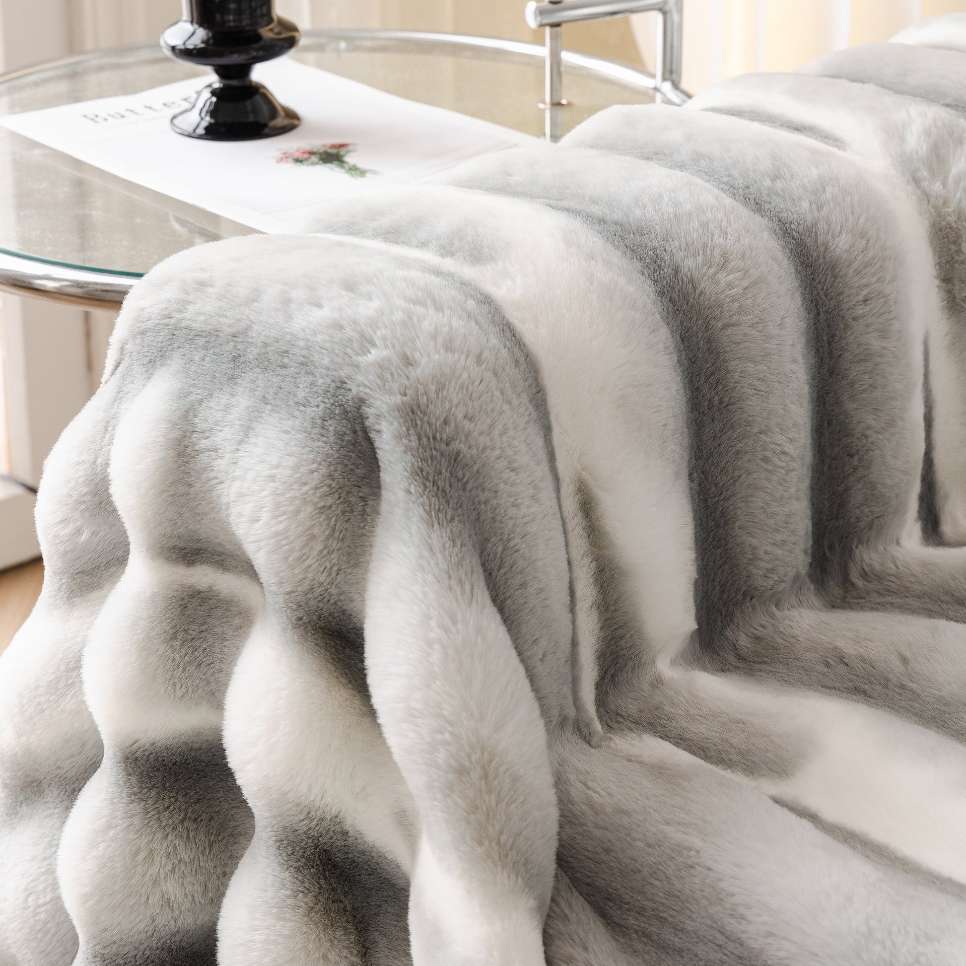 Ultra Soft Faux Fur Couch Cover – Large, Fluffy, and Elegant Sofa Throw Blanket displayed on a couch with a gradient pattern.