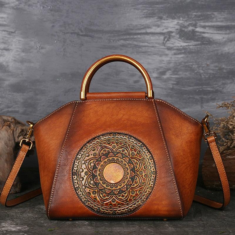 Mandala Embossed Leather Shoulder Bag with intricate mandala design, handcrafted cowhide tooled leather, and leather-wrapped handle.