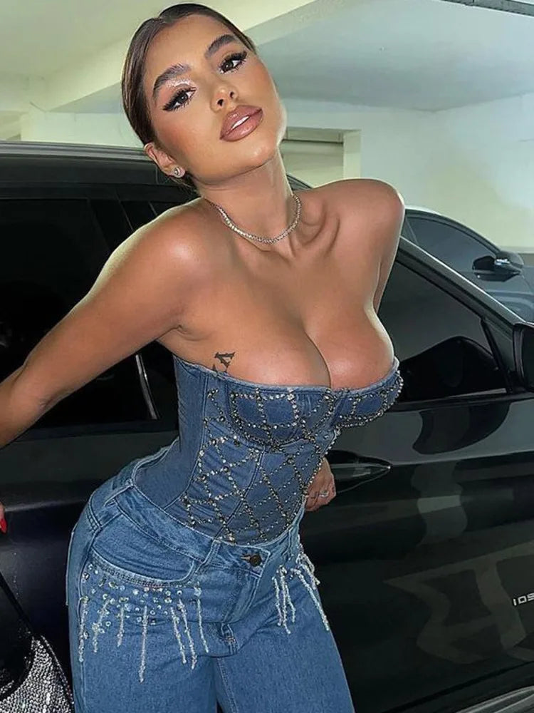 Rhinestone Cowgirl Denim Vest with sparkling design, adding Western glam elegance; model wearing the body-conforming vest by a car.