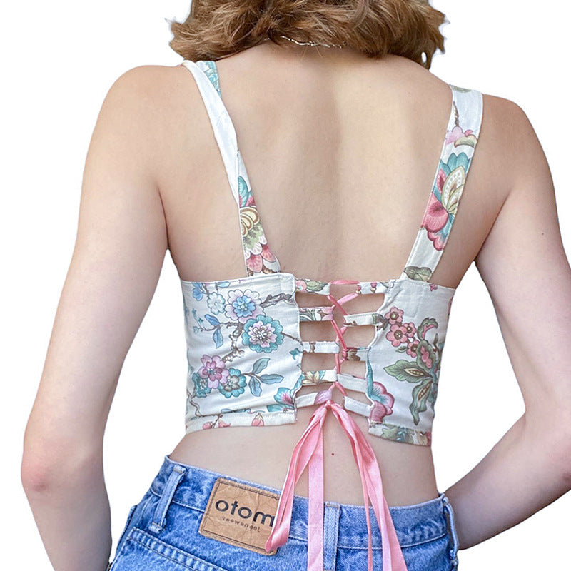 Back view of Floral Lace-Up Back Vest Top with floral print and lace-up design in soft pinks and blues.