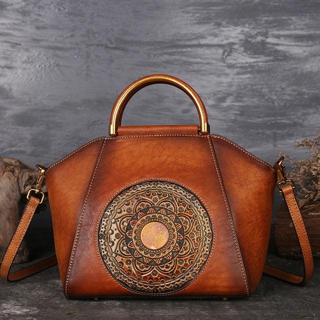 Mandala Embossed Leather Shoulder Bag with intricate design and leather-wrapped handle, showcasing craftsmanship and style.