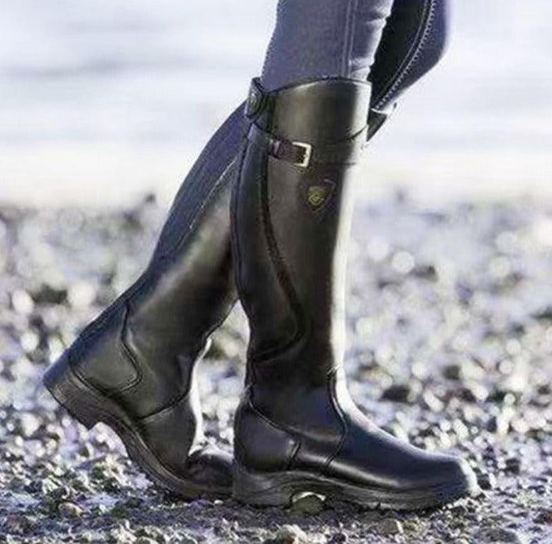 Vintage Ride Leather Boots - Stylish Retro Riding Boots for Trendy Women shown outdoors on gravel path