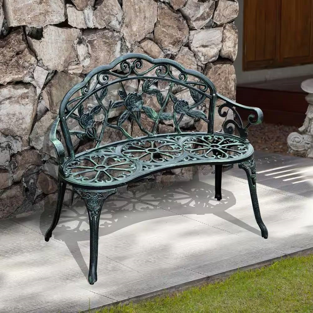 Outdoor Patio 40-inch Garden Bench with Backrest in Antique Green Metal Finish against stone wall