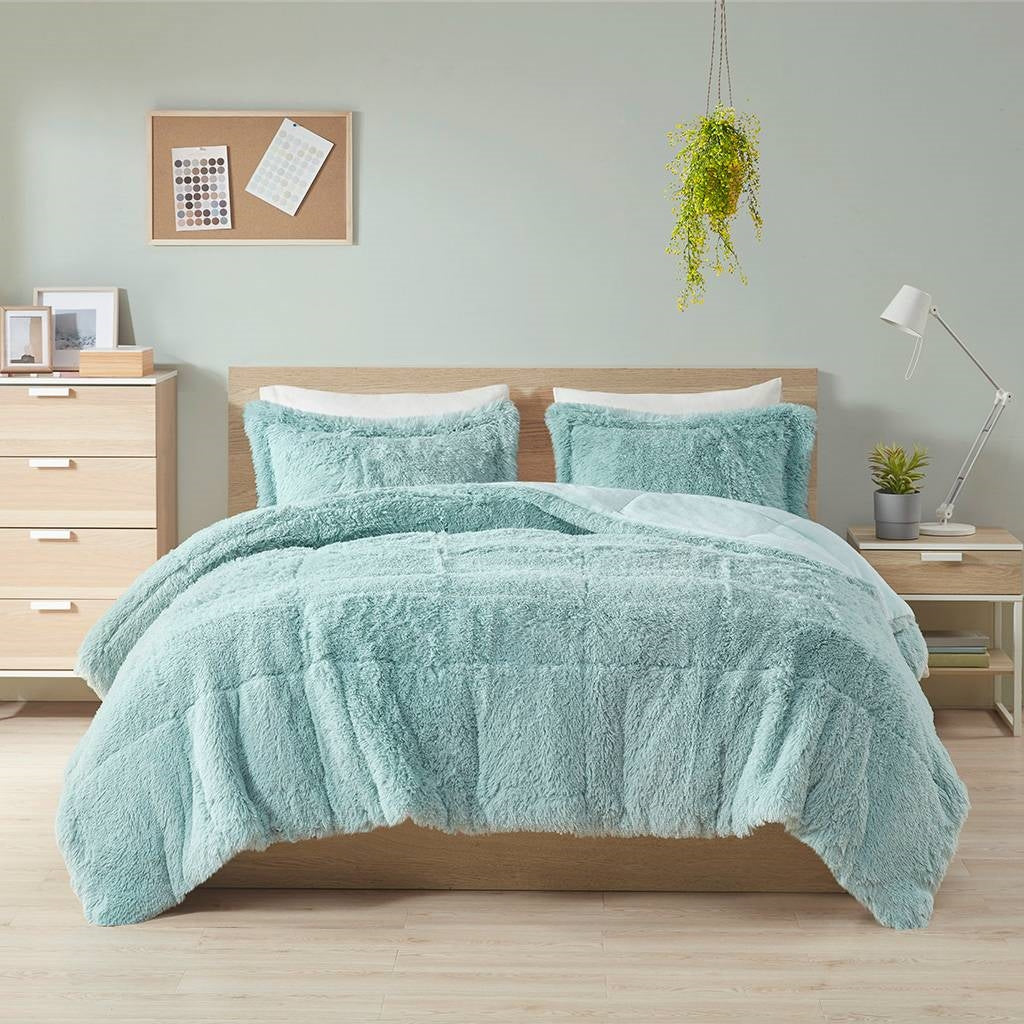 Full/Queen Soft Sherpa Faux Fur 3-Piece Comforter Set in Light Teal Blue displayed on bed in modern bedroom