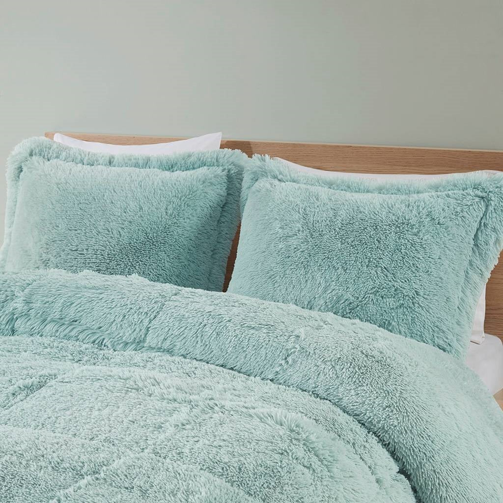 Twin/Twin XL Soft Sherpa Faux Fur 2-Piece Comforter Set in Light Teal Blue with fluffy texture on bed