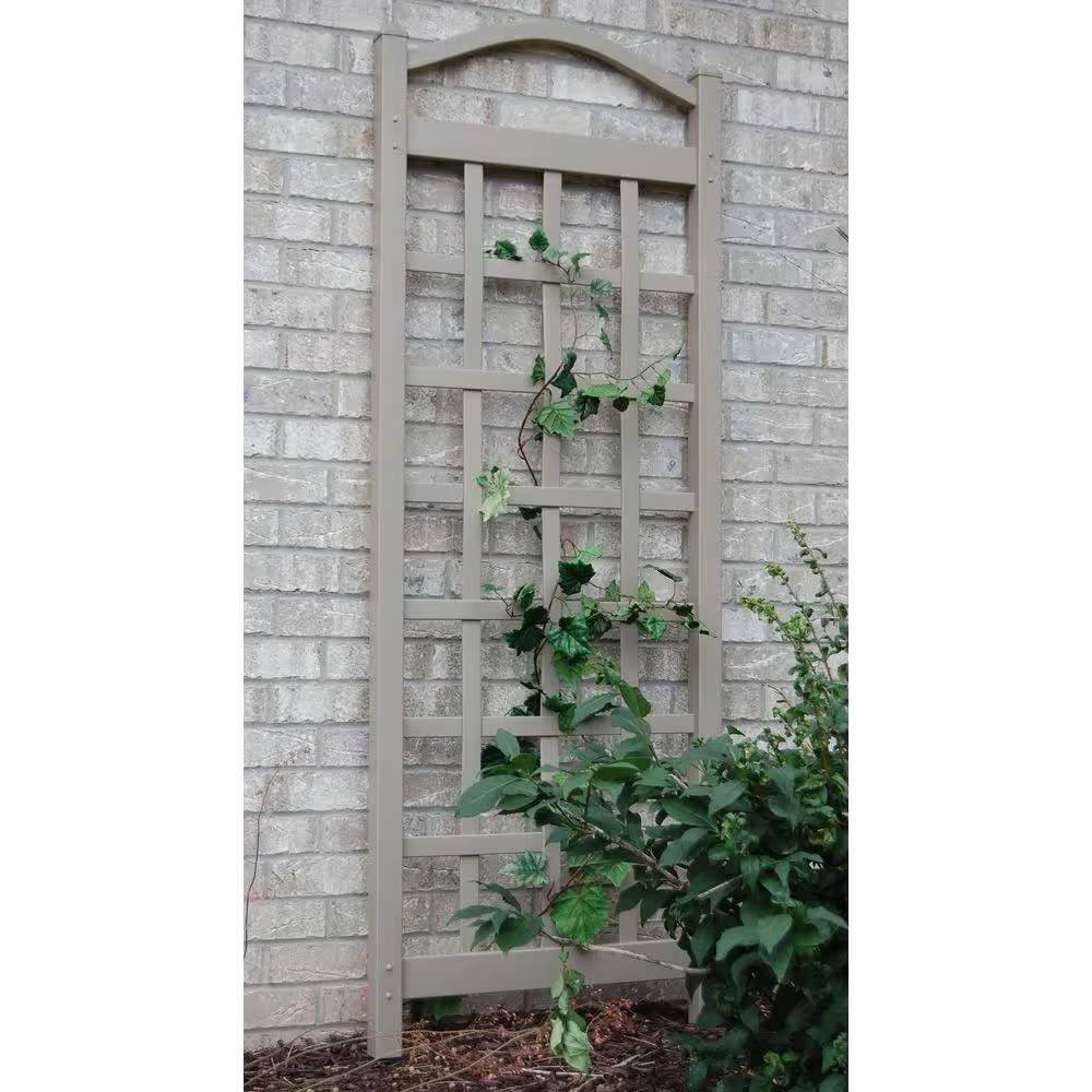 76-inch Tall Mocha Tan Brown Vinyl Garden Trellis with climbing vines against a brick wall, perfect for outdoor decor.
