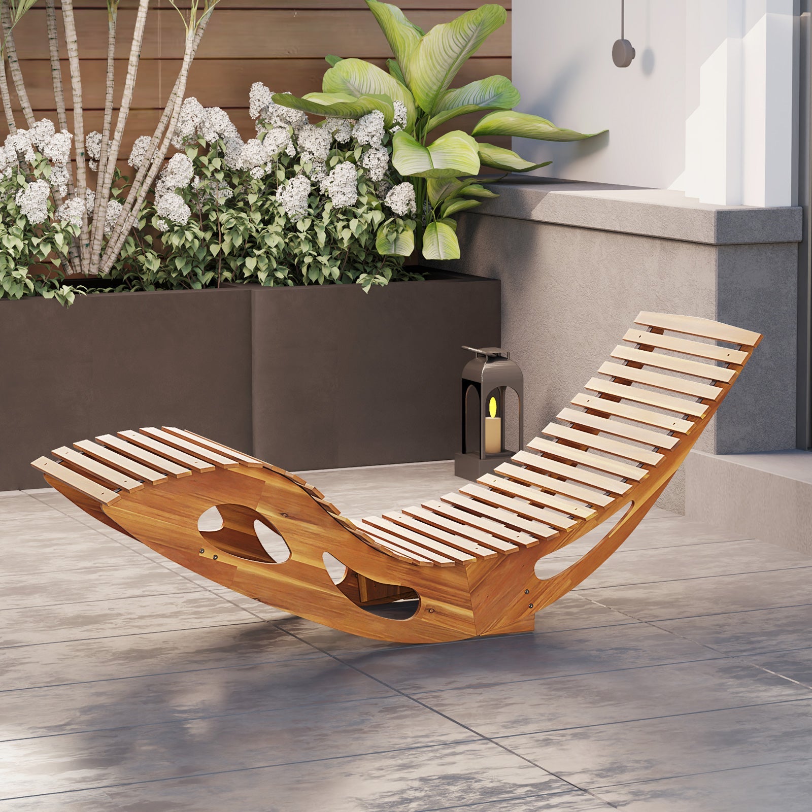 Acacia Wood Patio Rocking Sun Lounger Chaise Lounge with Ergonomic Curved Seat in backyard.
