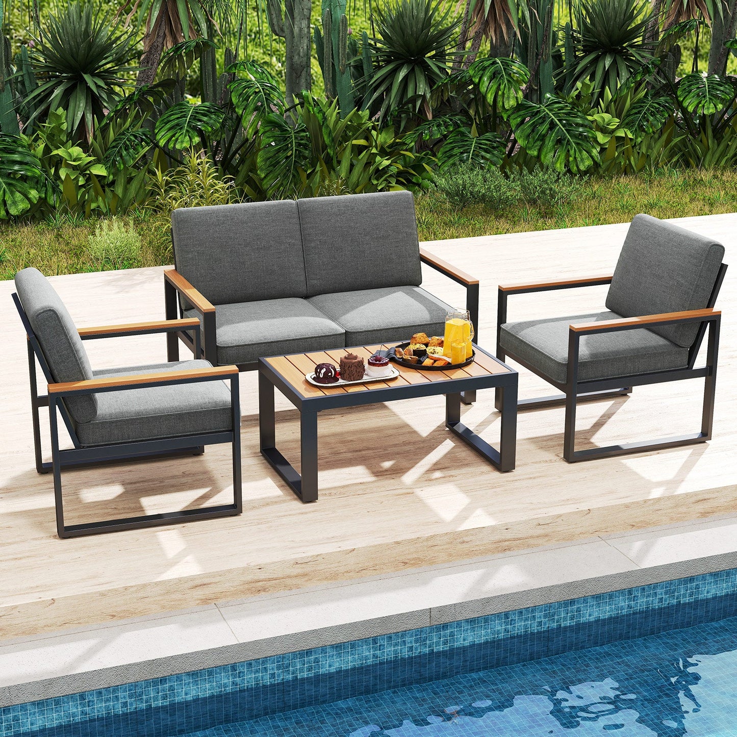 4 Piece Patio Aluminum Furniture Set with Armrests and Tabletop-Gray next to a pool with lush greenery in the background.