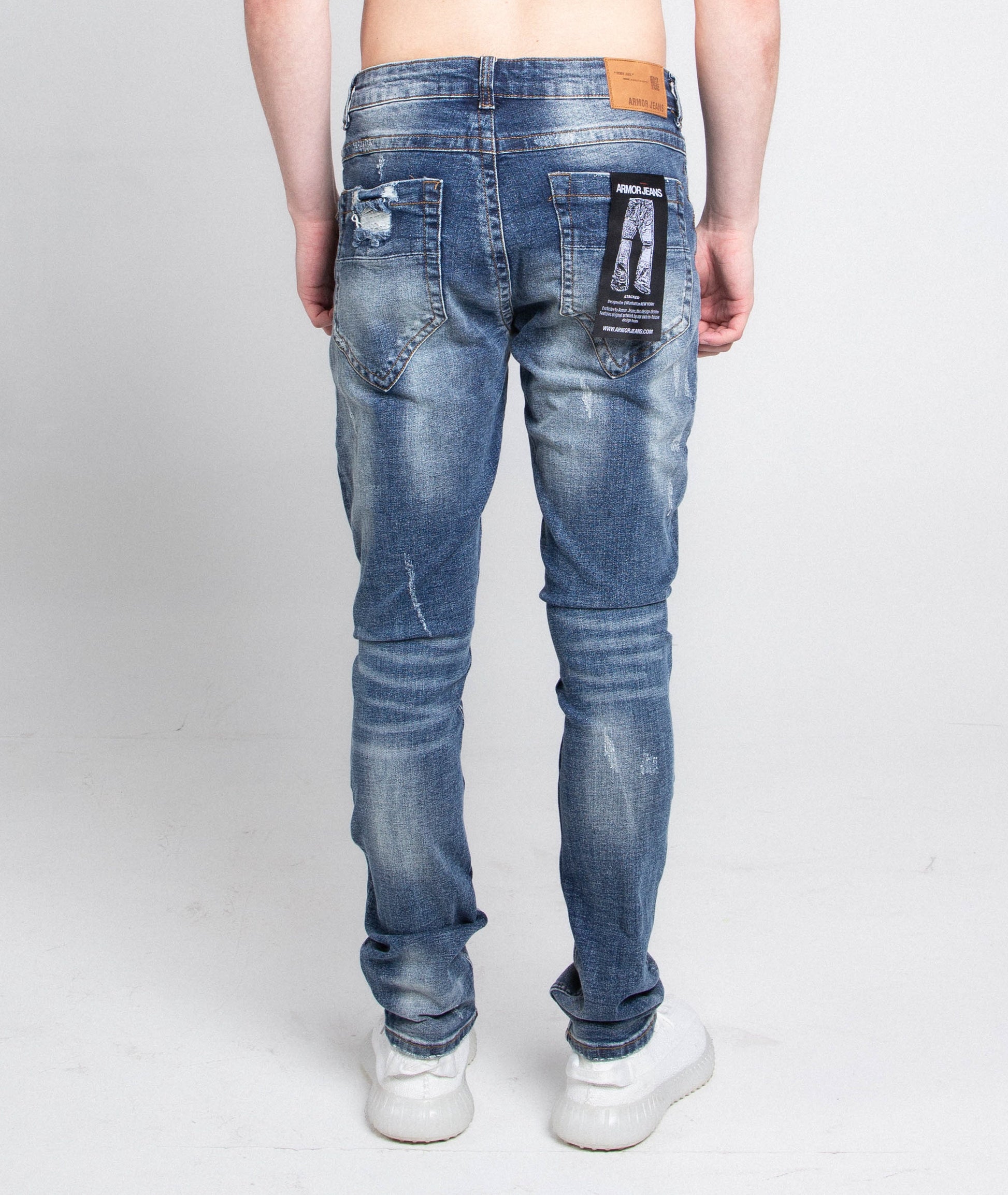 Back view of A406 CASUAL DISTRESSED SKINNY JEANS showcasing distressed denim and five-pocket design. Perfect casual wear for style enthusiasts.
