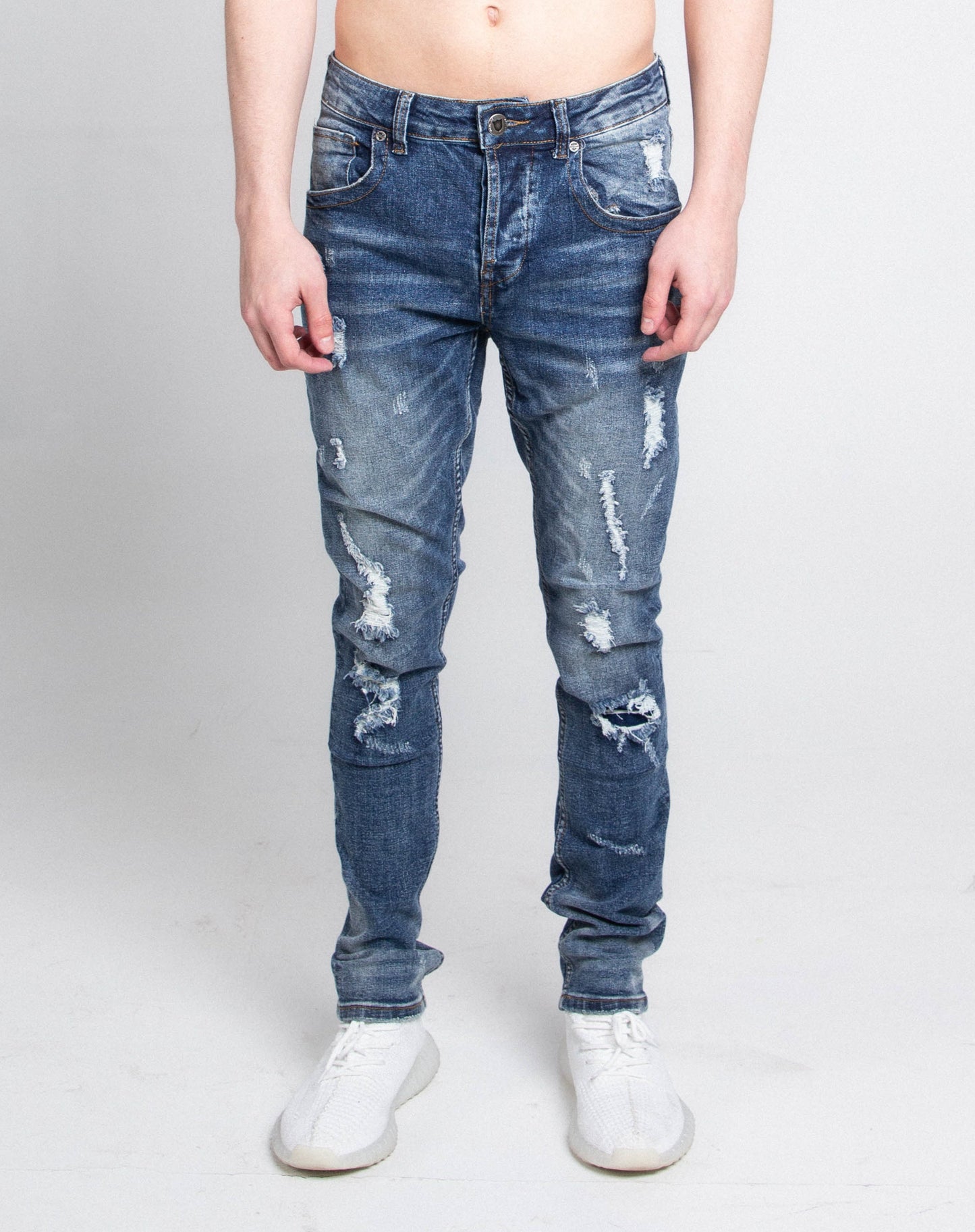 A406 CASUAL DISTRESSED SKINNY JEANS with mid-rise waist and stretchy fabric featuring five-pocket design and zipper fly.