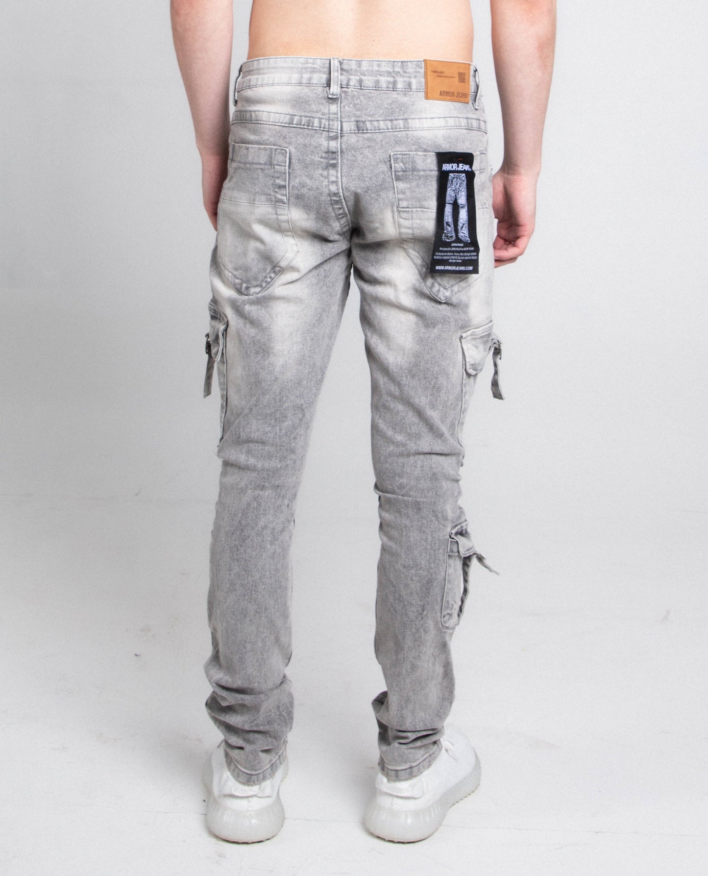 Rear view of A408 CARGO POCKETS GREY SKINNY jeans with mid rise waist and ripped slim leg design, showing five pockets and belt loops.