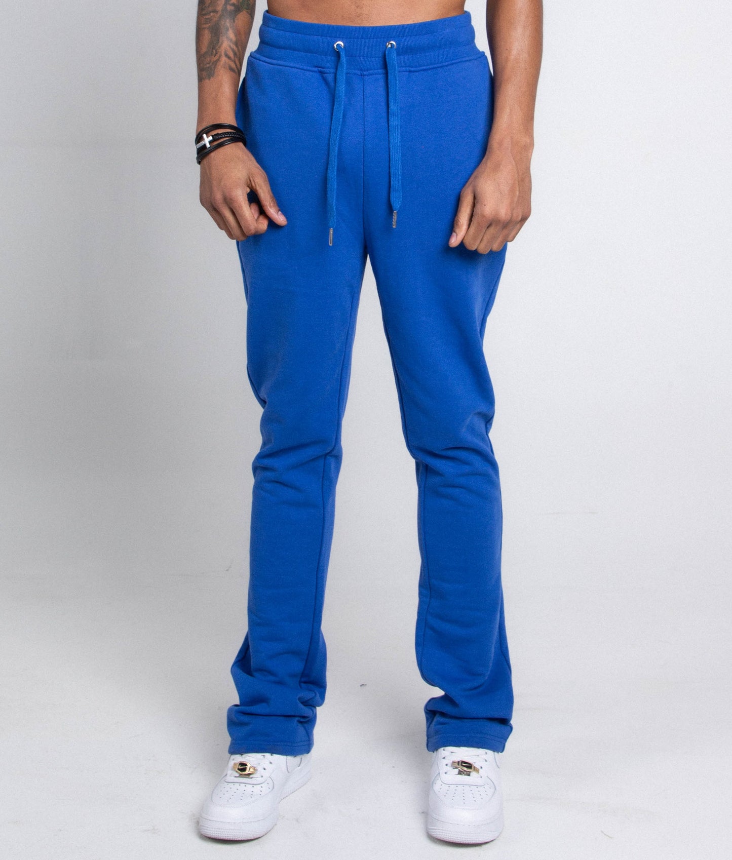M5690-AJSKP MULTI-COLOR STACKED SWEATPANTS with adjustable drawstrings and pockets, shown on model in blue.