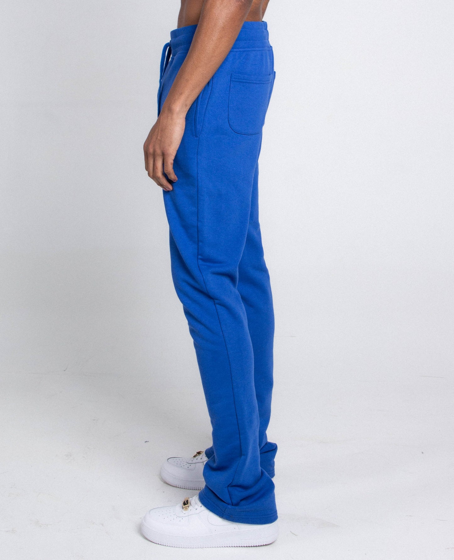 Side view of blue M5690-AJSKP MULTI-COLOR STACKED SWEATPANTS with elastic waistband and pockets