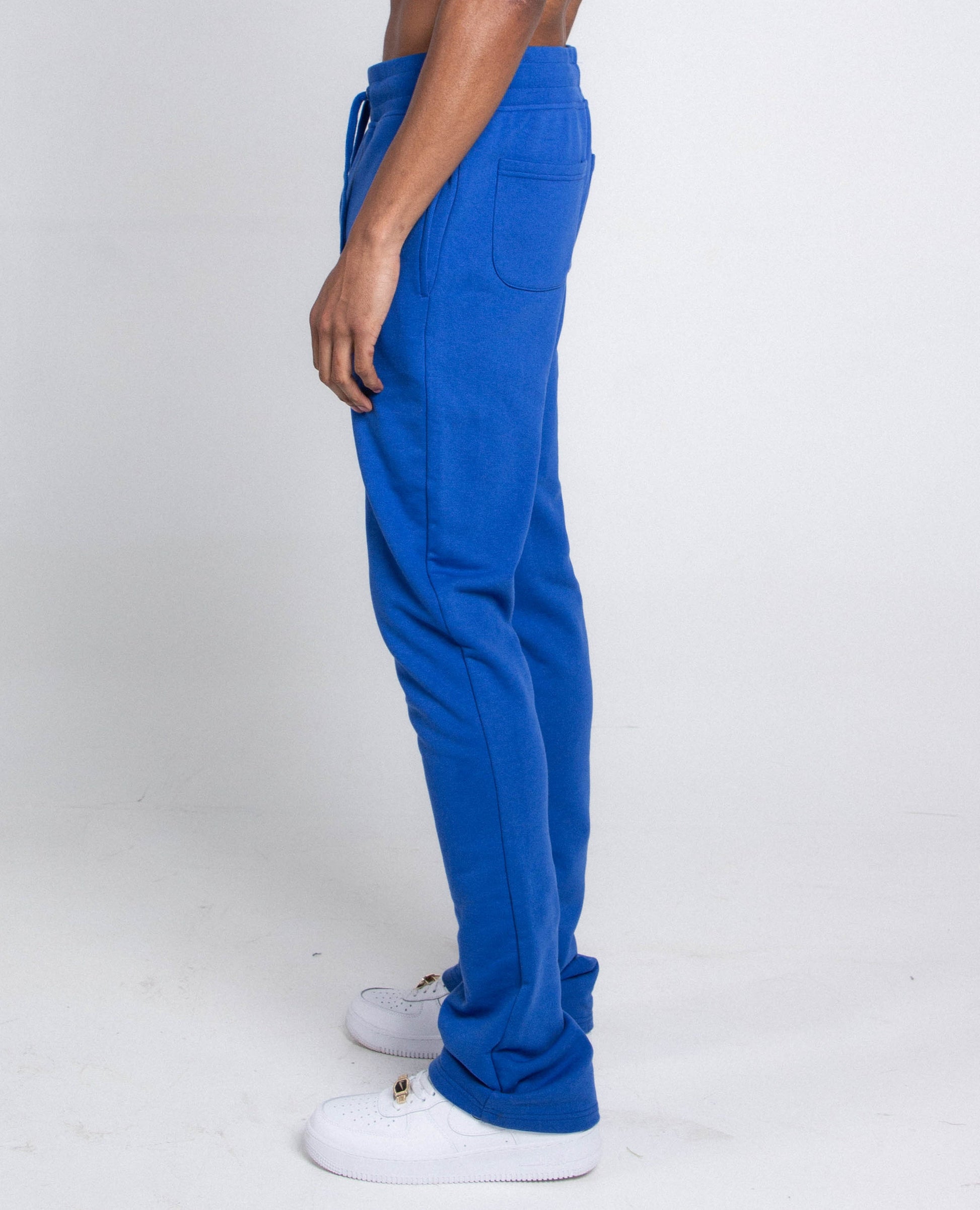 Side view of blue M5690-AJSKP MULTI-COLOR STACKED SWEATPANTS with elastic waistband and pockets
