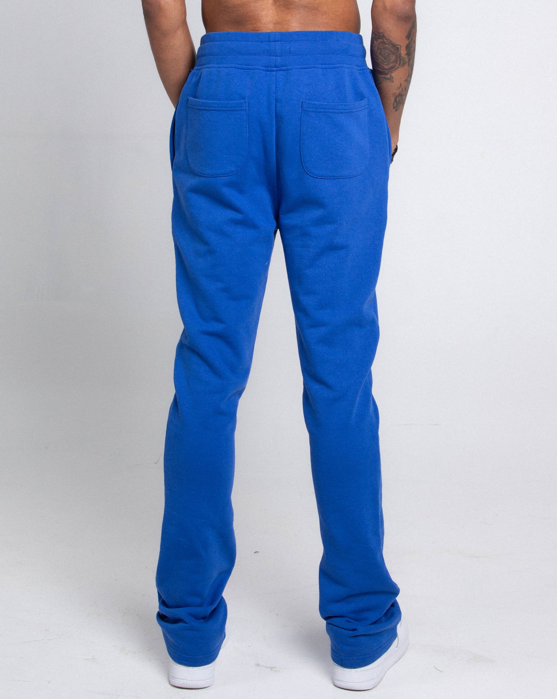 Back view of M5690-AJSKP MULTI-COLOR STACKED SWEATPANTS with elastic waistband and pockets.