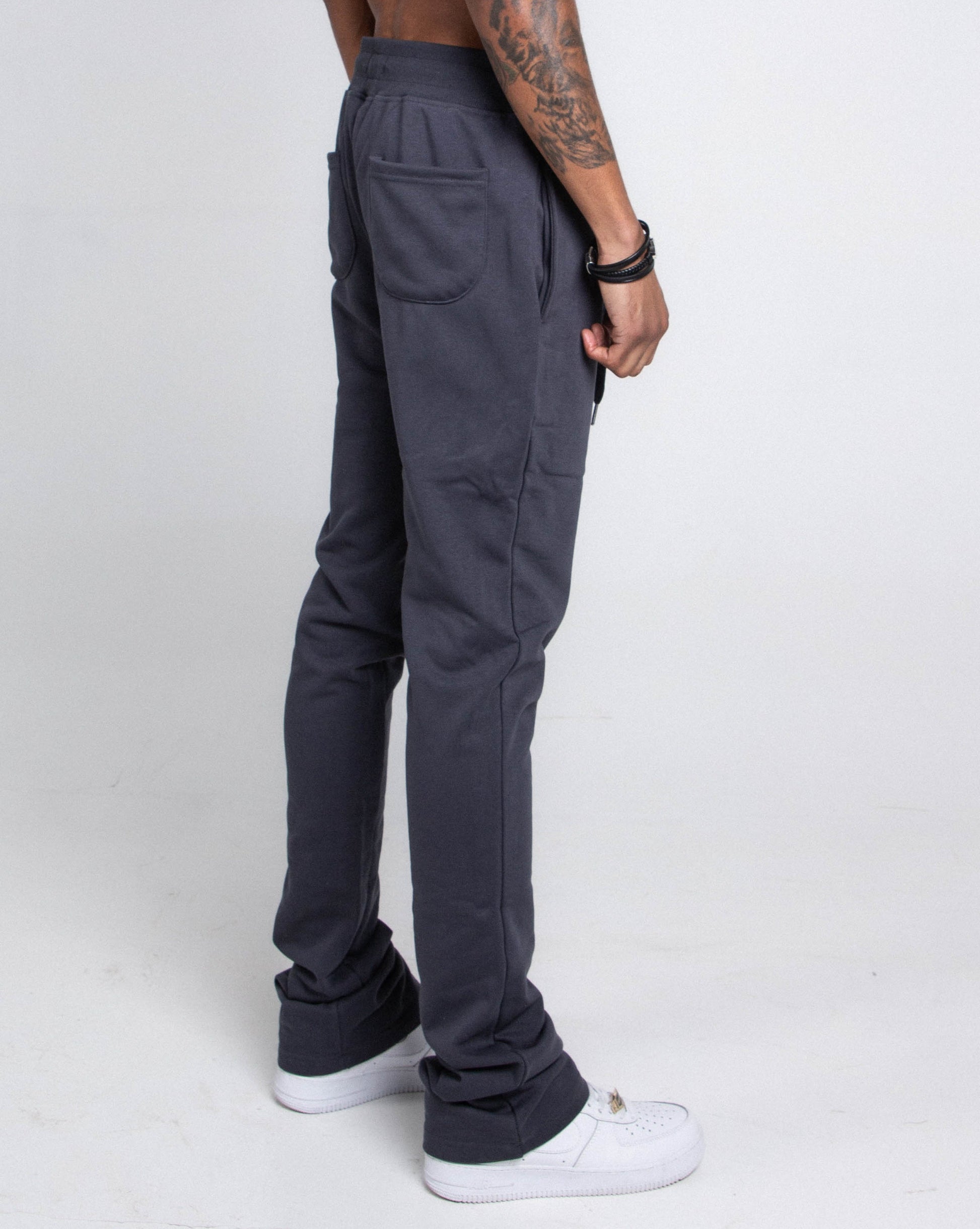 Side view of M5690-AJSKP MULTI-COLOR STACKED SWEATPANTS with elastic waistband and pockets
