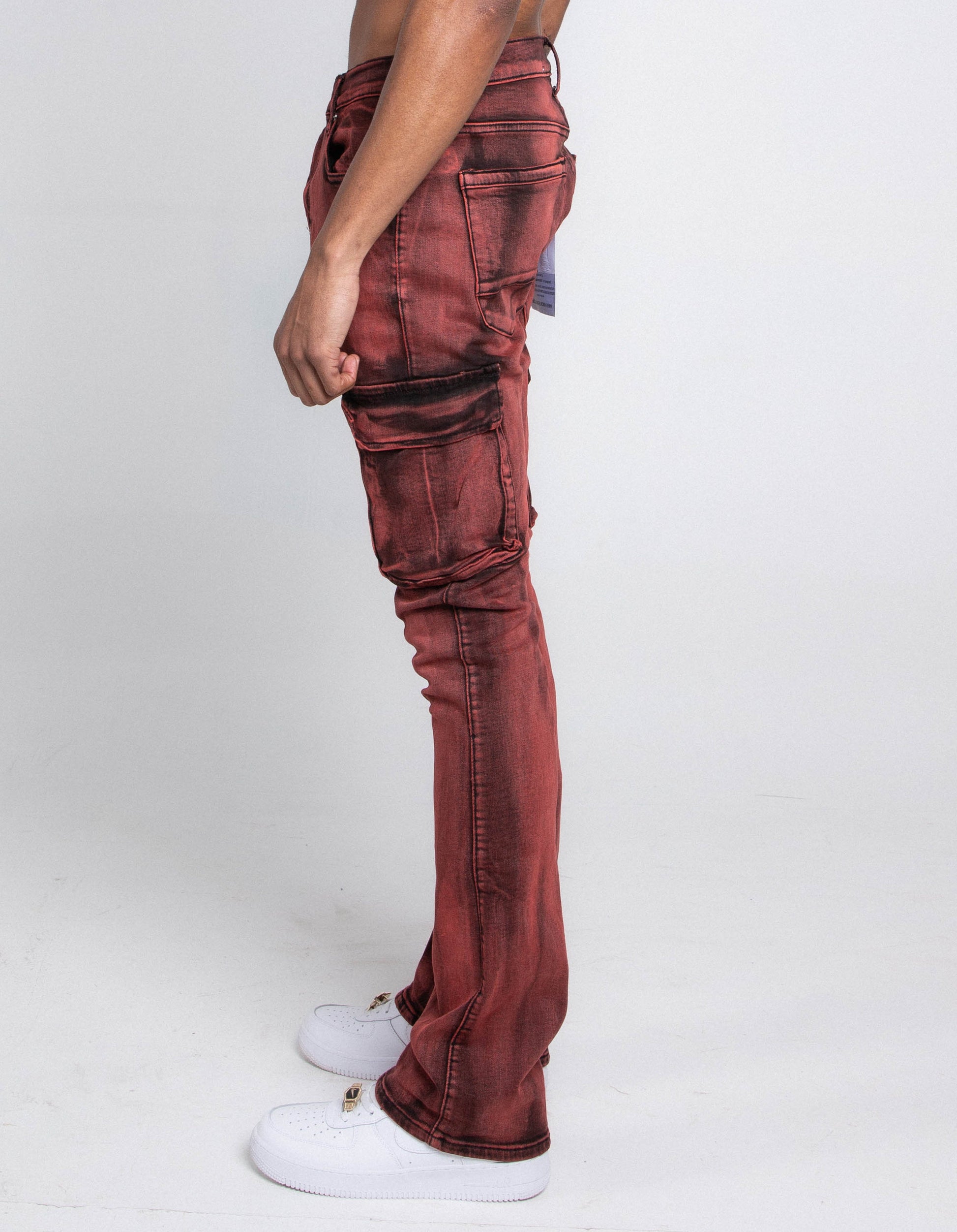 Side view of AJ29SK GREY/WHITE WASH STACKED CARGO JEANS featuring cargo pockets and stretchy fabric, showcased on a model.