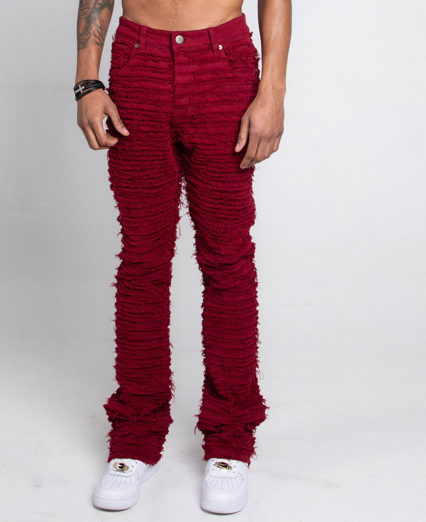 AJS693 EXTREME FRAYED STACKED JEANS in red showcasing the unique frayed design and tailored fit.