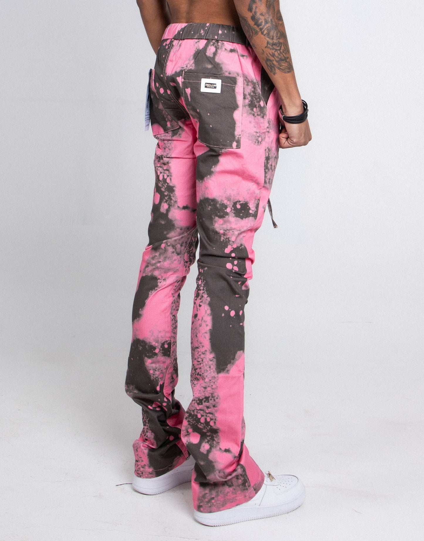 Back view of AJ04L COLOR DYE LOOSE JEANS with pink and gray design, featuring straight-leg and mid-rise waist.