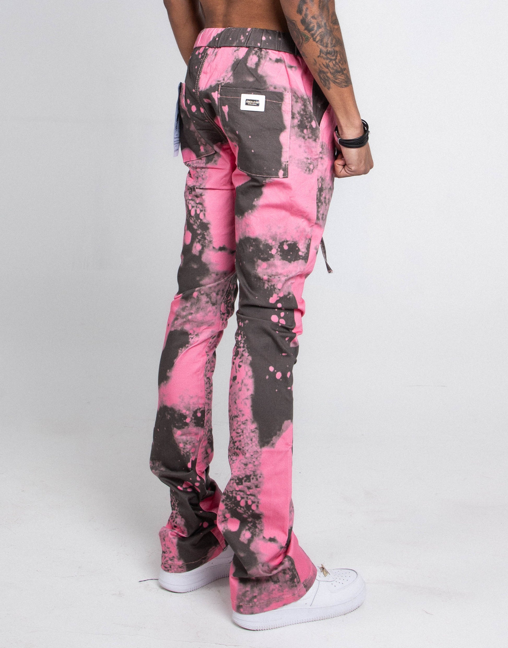 Back view of AJ04L COLOR DYE LOOSE JEANS with pink and gray design, featuring straight-leg and mid-rise waist.