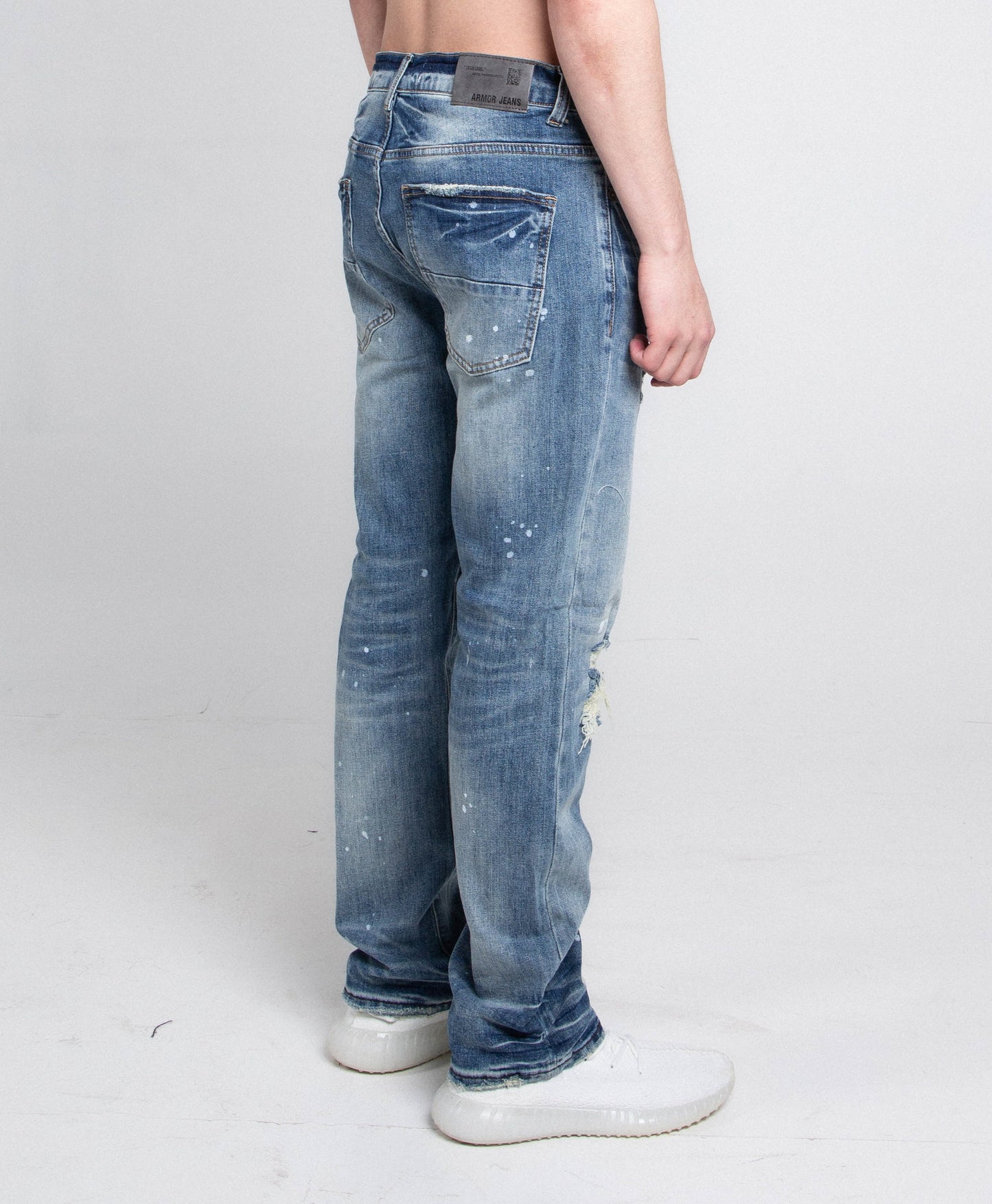 Back view of AJ05C CASUAL SKINNY DISTRESSED JEANS showcasing mid-rise waist, skinny leg, distressed denim style and stretchy fabric.