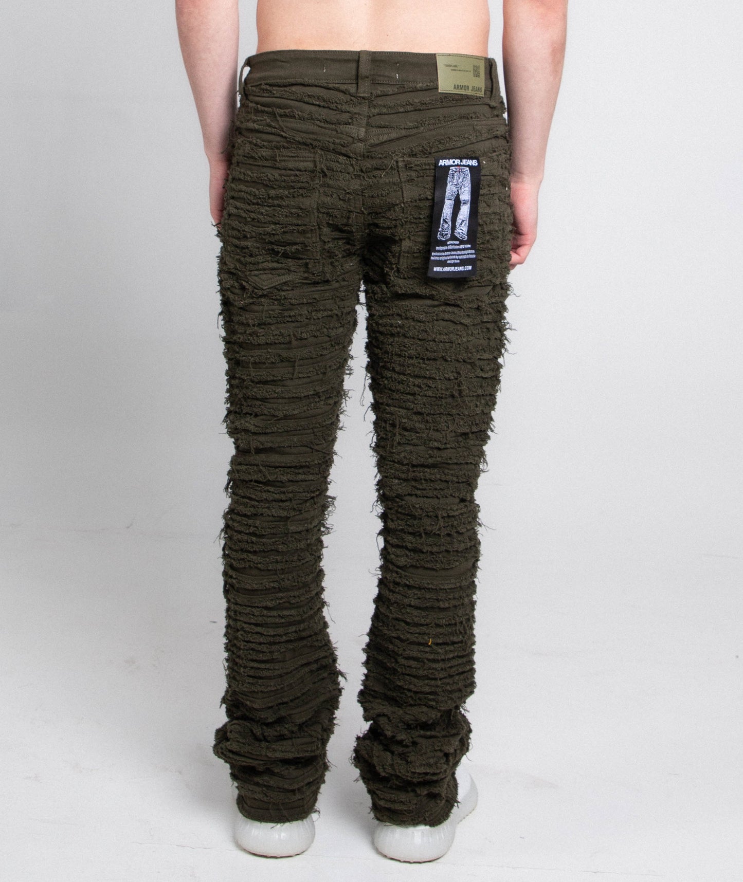Back view of AJS693 EXTREME FRAYED STACKED JEANS in stretchy fabric and mid-rise design.