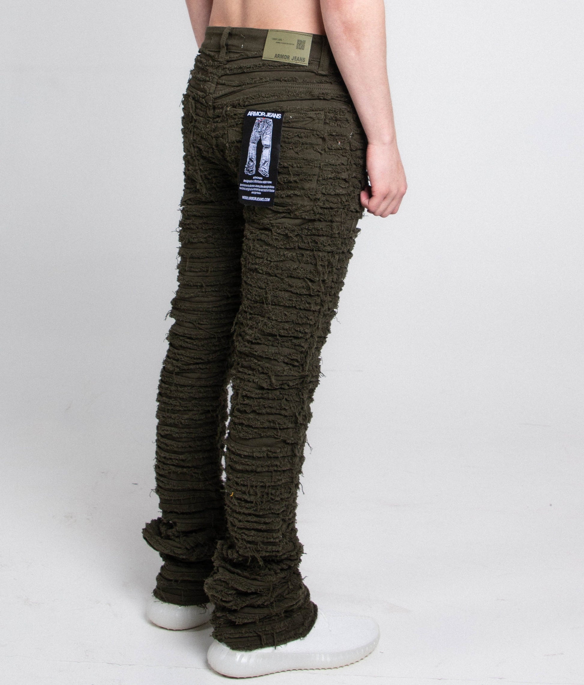Back view of AJS693 EXTREME FRAYED STACKED JEANS featuring frayed design, mid-rise waist, and stretchy cotton fabric with five-pocket style.
