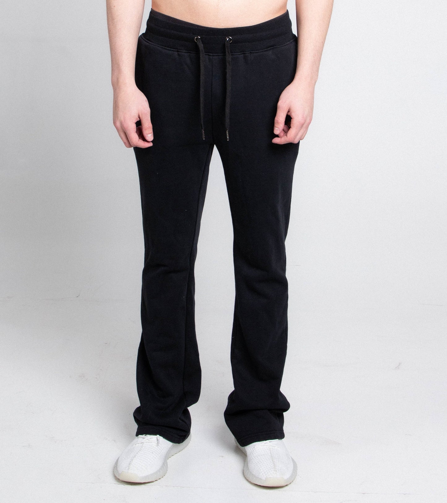 Model wearing M5690-AJSKP MULTI-COLOR STACKED SWEATPANTS with elastic waistband and drawstrings, front view.