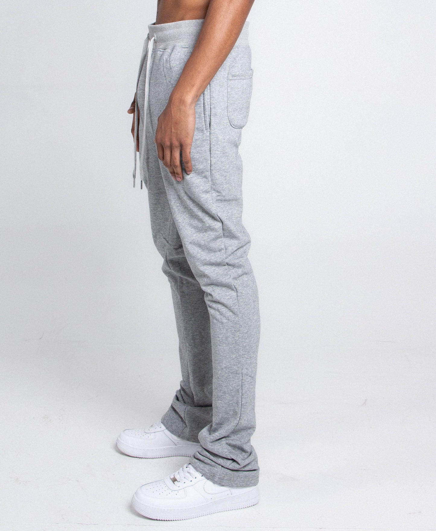 Side view of M5690-AJSKP MULTI-COLOR STACKED SWEATPANTS showing elastic waist and adjustable drawstrings.