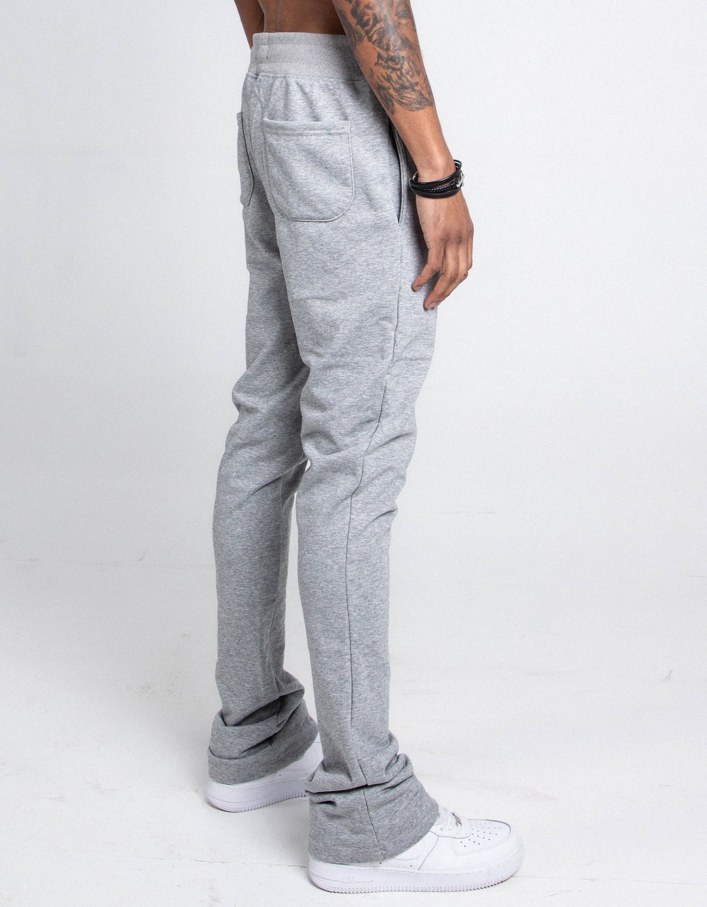 Side view of M5690-AJSKP MULTI-COLOR STACKED SWEATPANTS with elastic waistband, adjustable drawstrings, back and side pockets.