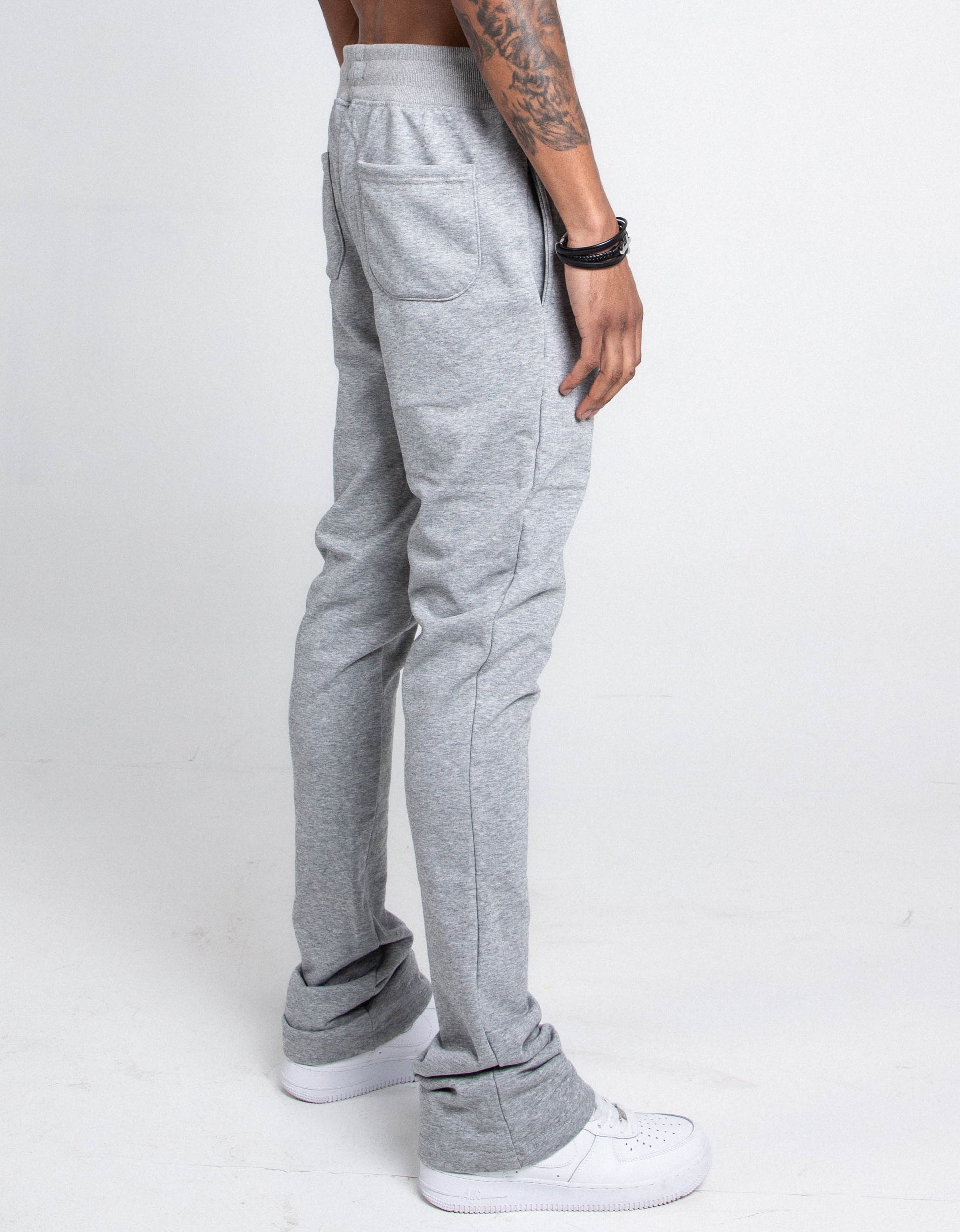 Side view of M5690-AJSKP MULTI-COLOR STACKED SWEATPANTS with elastic waistband, adjustable drawstrings, back and side pockets.