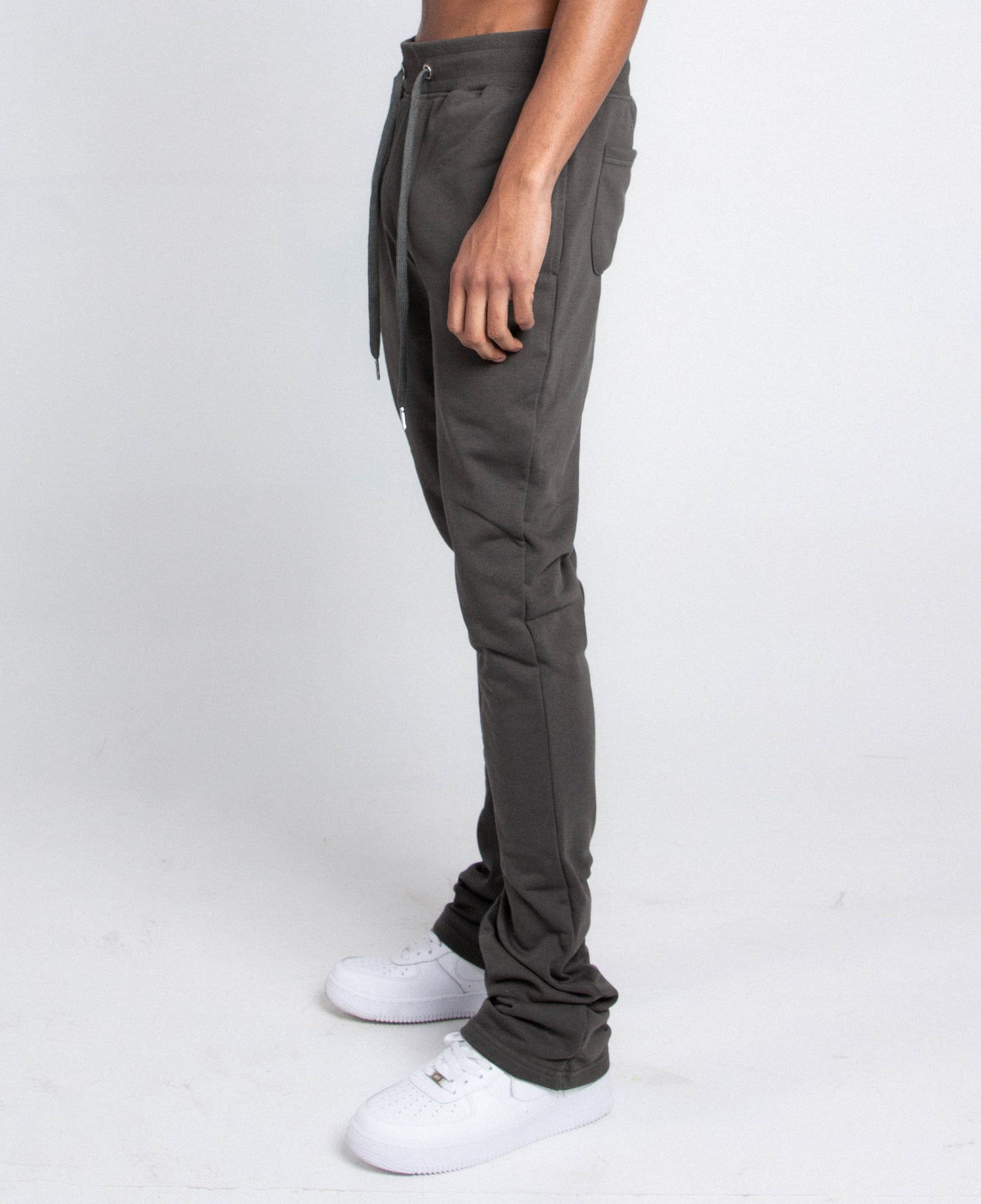Side view of M5690-AJSKP MULTI-COLOR STACKED SWEATPANTS with elastic waistband, adjustable drawstrings, and pockets.
