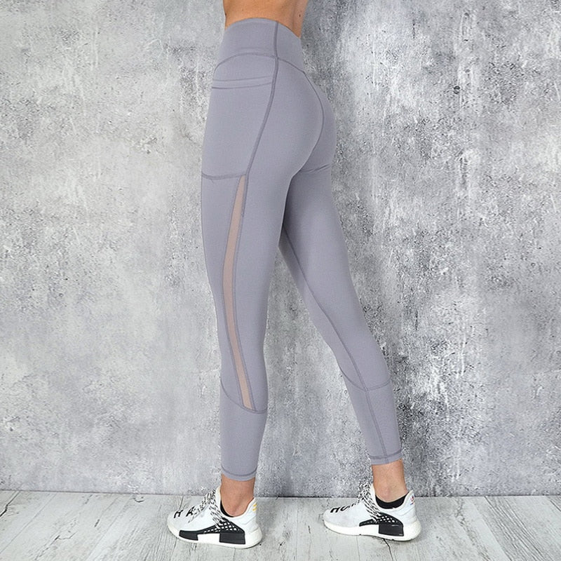 Side view of Yoga Leggings with Phone Pocket featuring spliced pattern and breathable mesh details, perfect for active lifestyles.