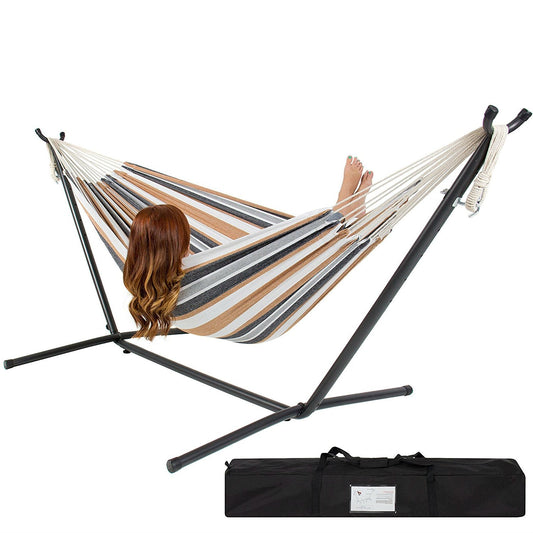 Portable Cotton Hammock in Desert Strip with Metal Stand and Carry Case in use outdoors.